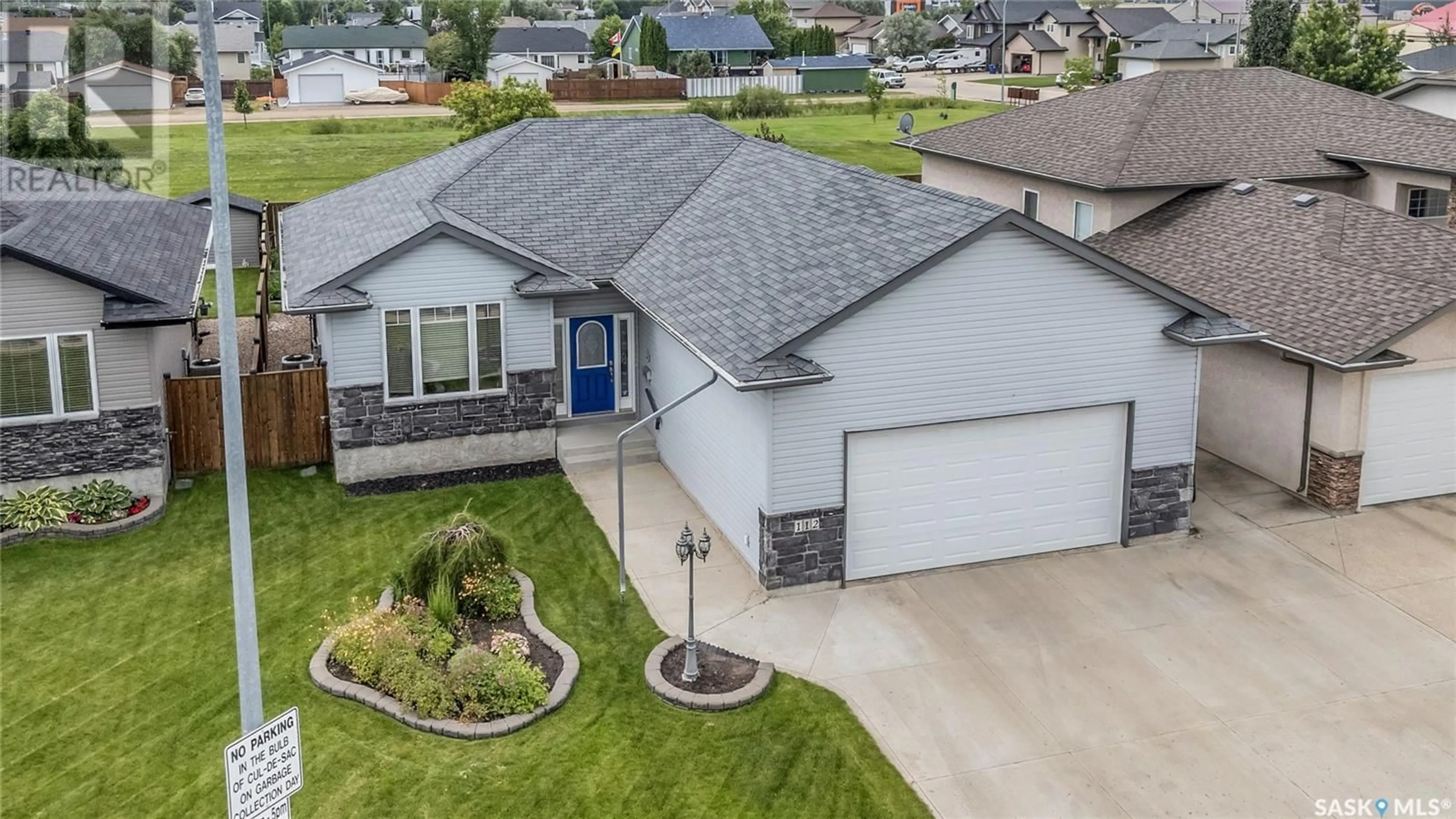 A pic from outside/outdoor area/front of a property/back of a property/a pic from drone, street for 112 EWLES PLACE, Martensville Saskatchewan S0K2T2