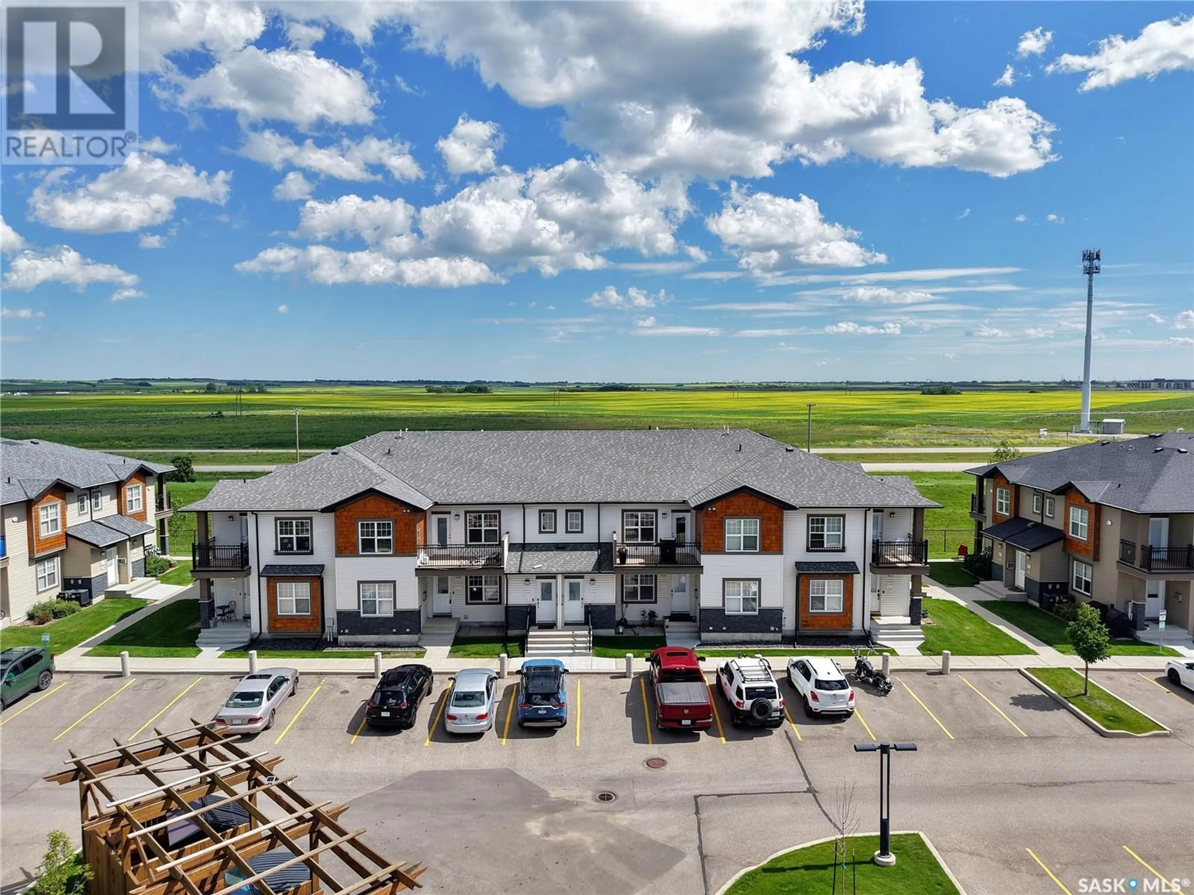 A pic from outside/outdoor area/front of a property/back of a property/a pic from drone, unknown for 1015 - 2108 PATRICK CRESCENT, Saskatoon Saskatchewan S7W0M1