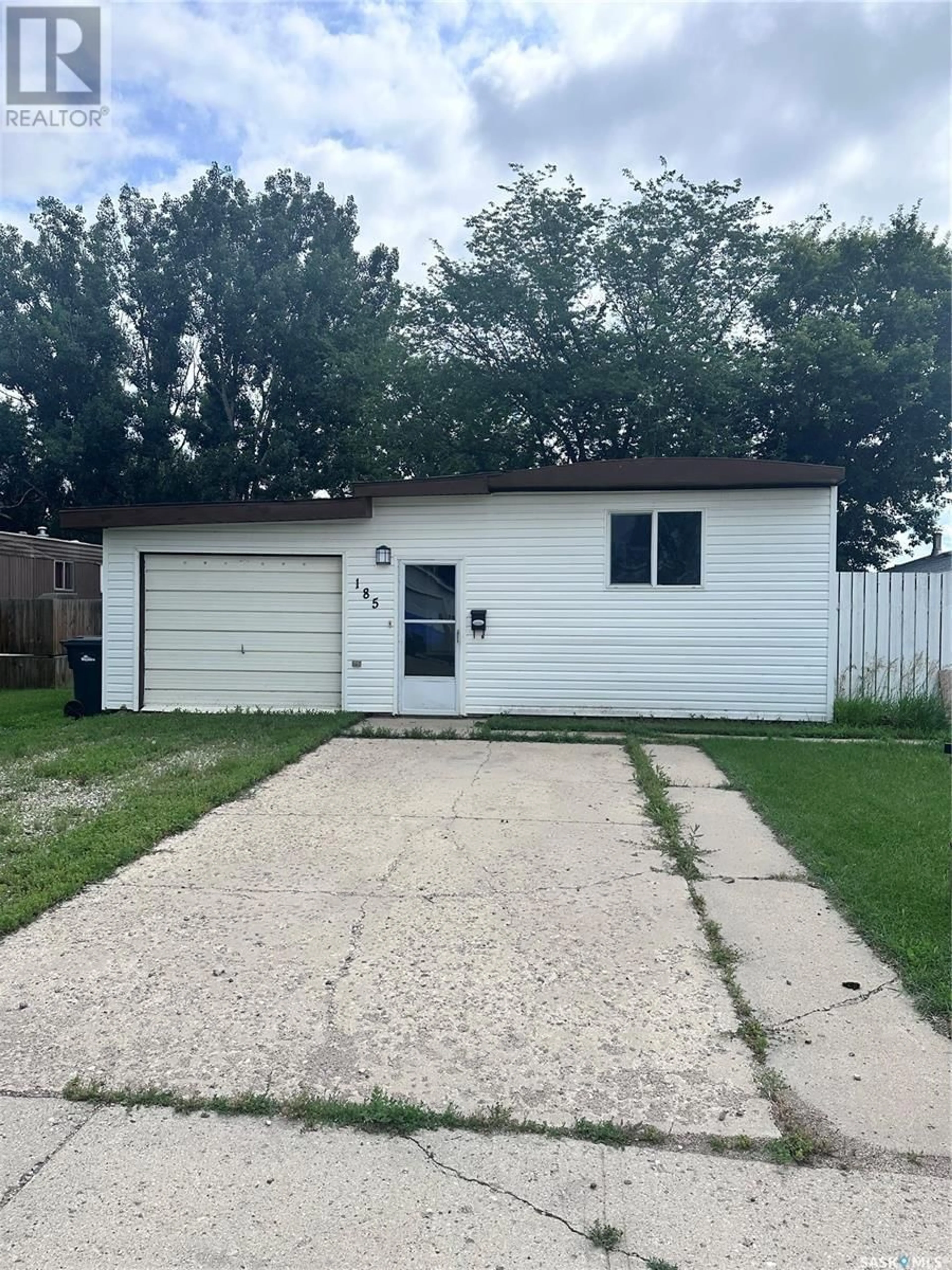 Home with vinyl exterior material, street for 185 LAING CRESCENT, Weyburn Saskatchewan S4H2R8