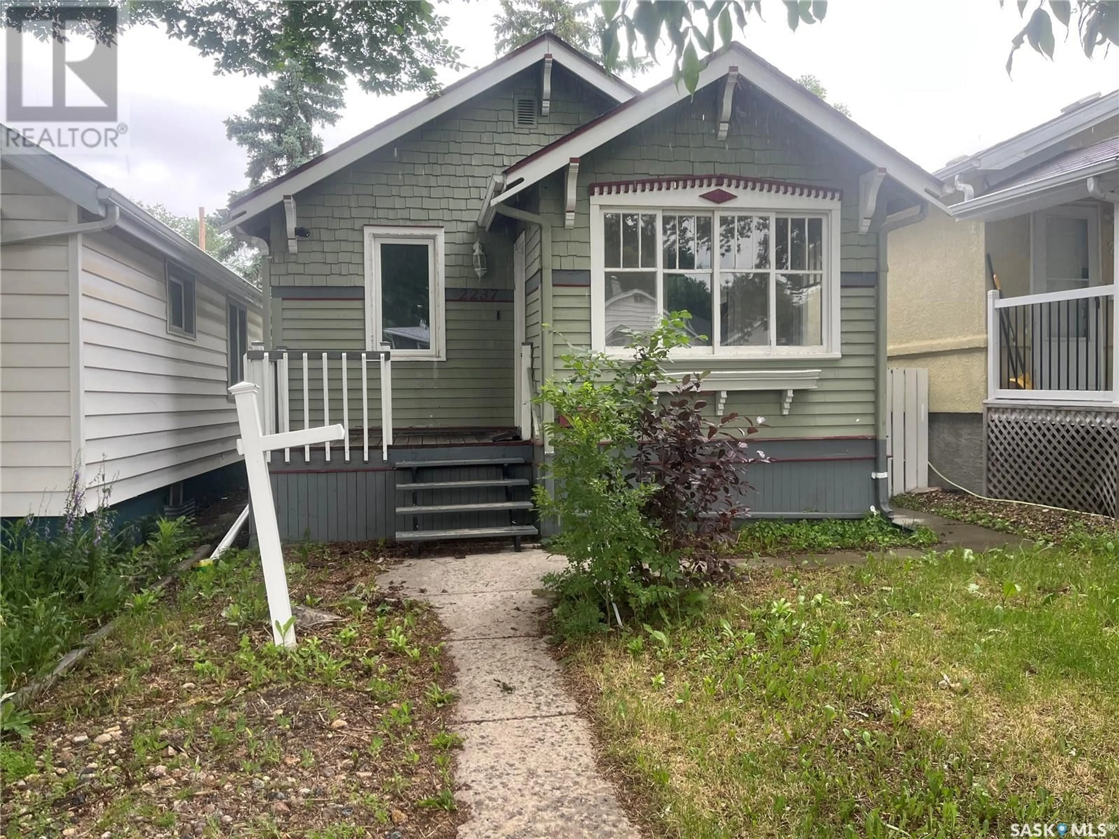Home with vinyl exterior material, street for 2237 BRODER STREET, Regina Saskatchewan S4N3S7