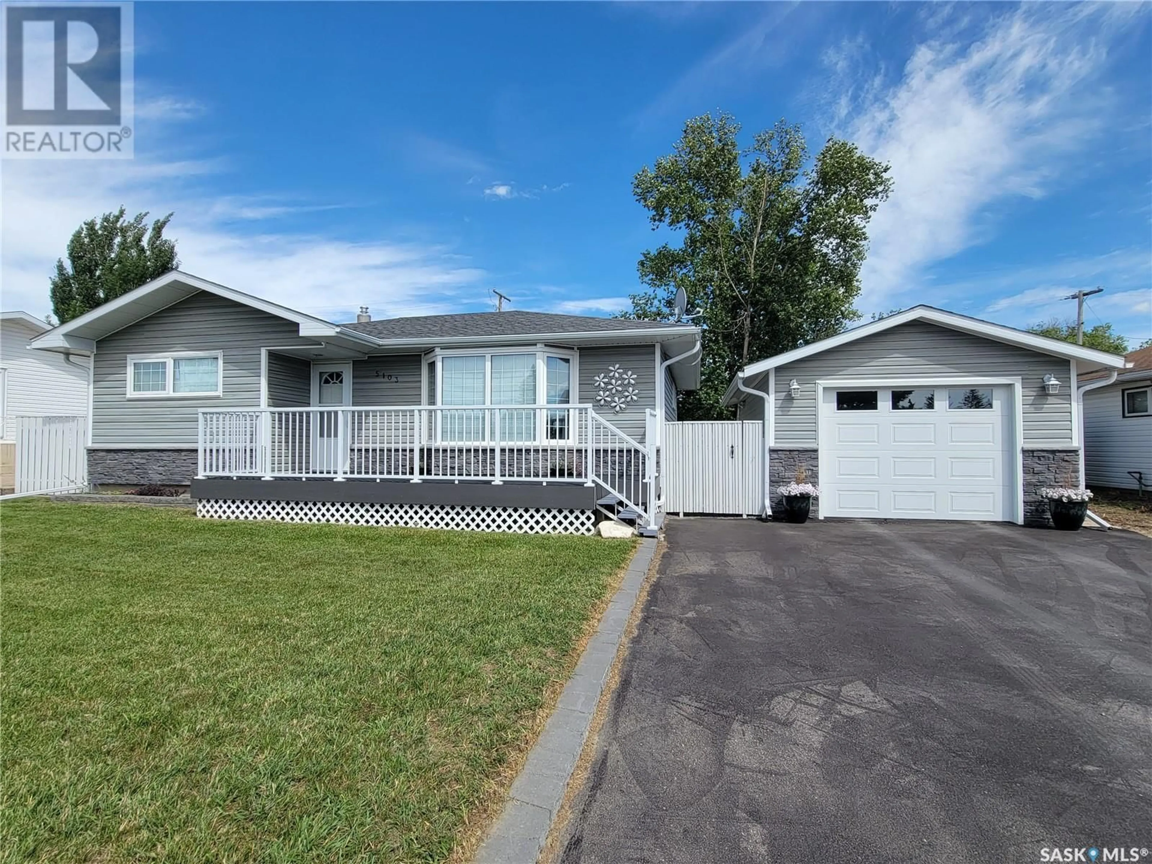 Home with vinyl exterior material, street for 5103 LEADER STREET, Macklin Saskatchewan S0L2C0