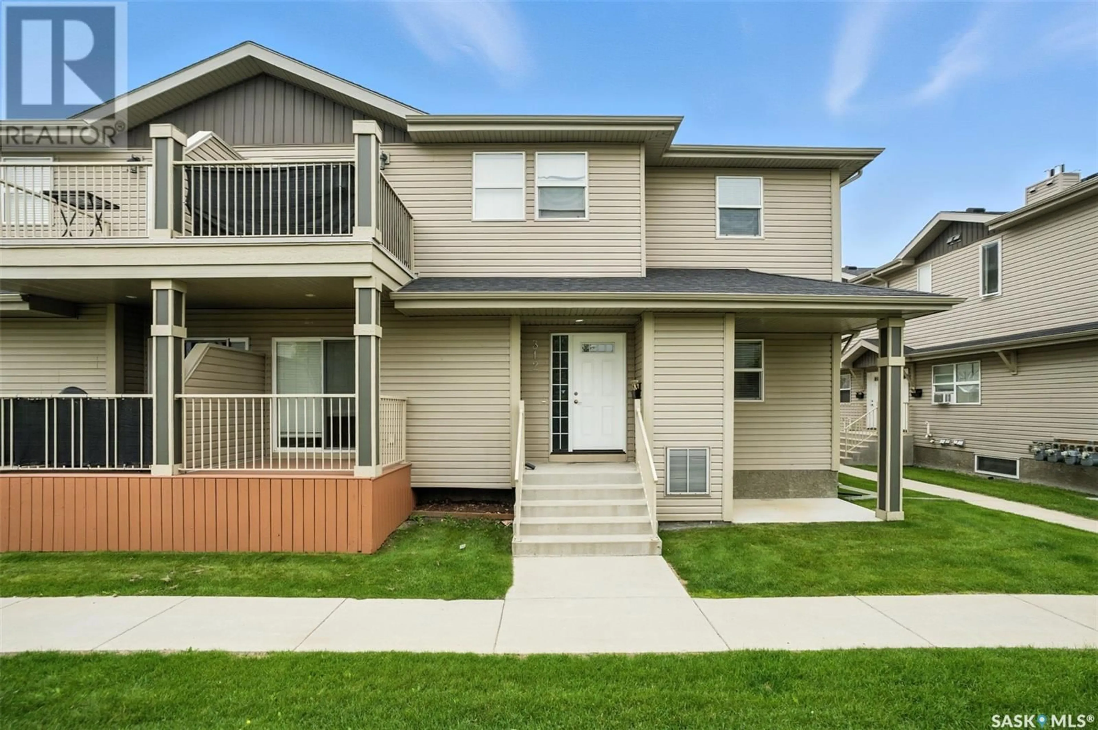 Home with vinyl exterior material, street for 100 - 312 CHAPARRAL BOULEVARD, Martensville Saskatchewan S0K2T0