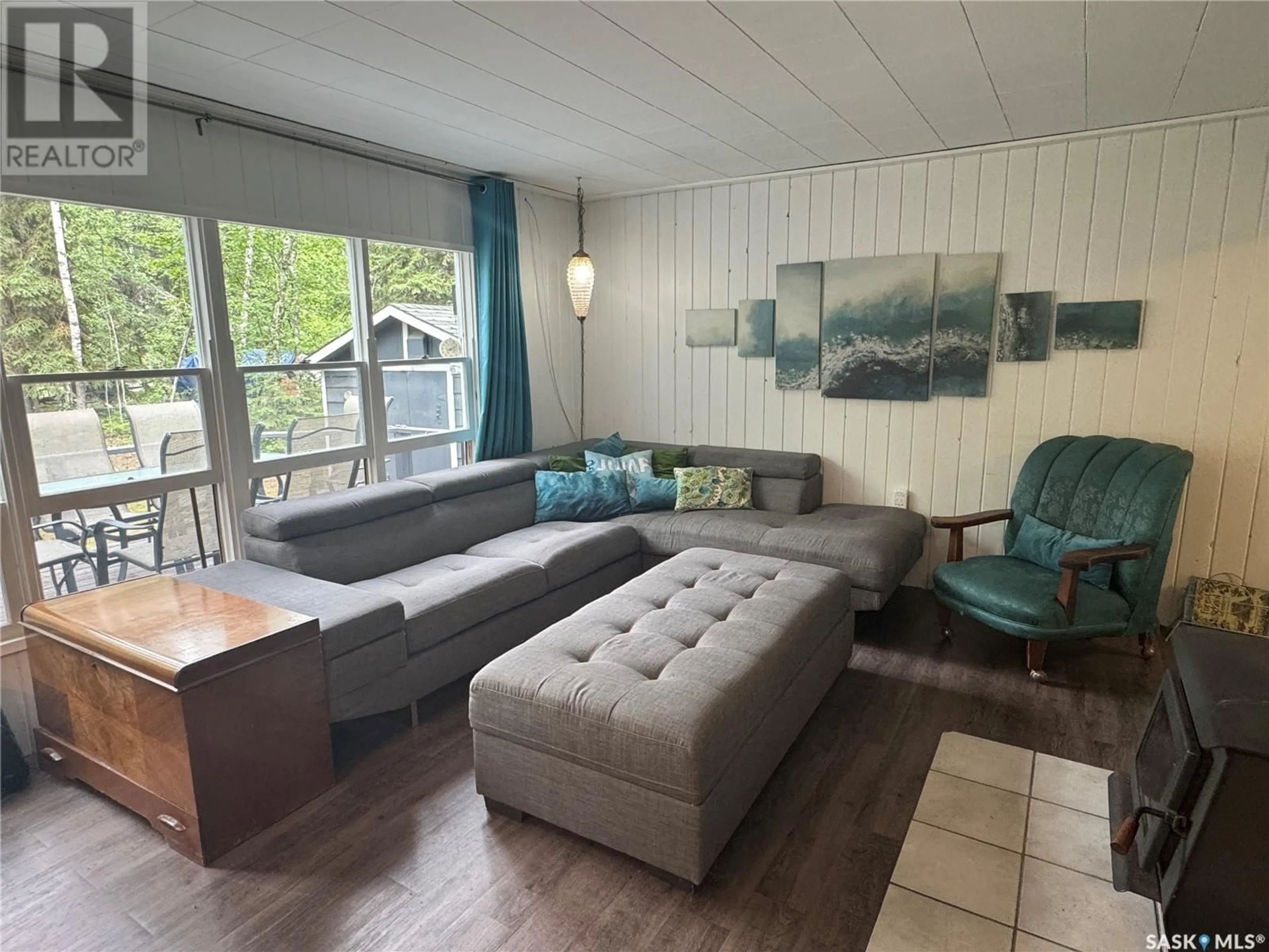 Living room with furniture, wood/laminate floor for 1504 SPRUCE STREET, Northern Admin District Saskatchewan S0J1L0