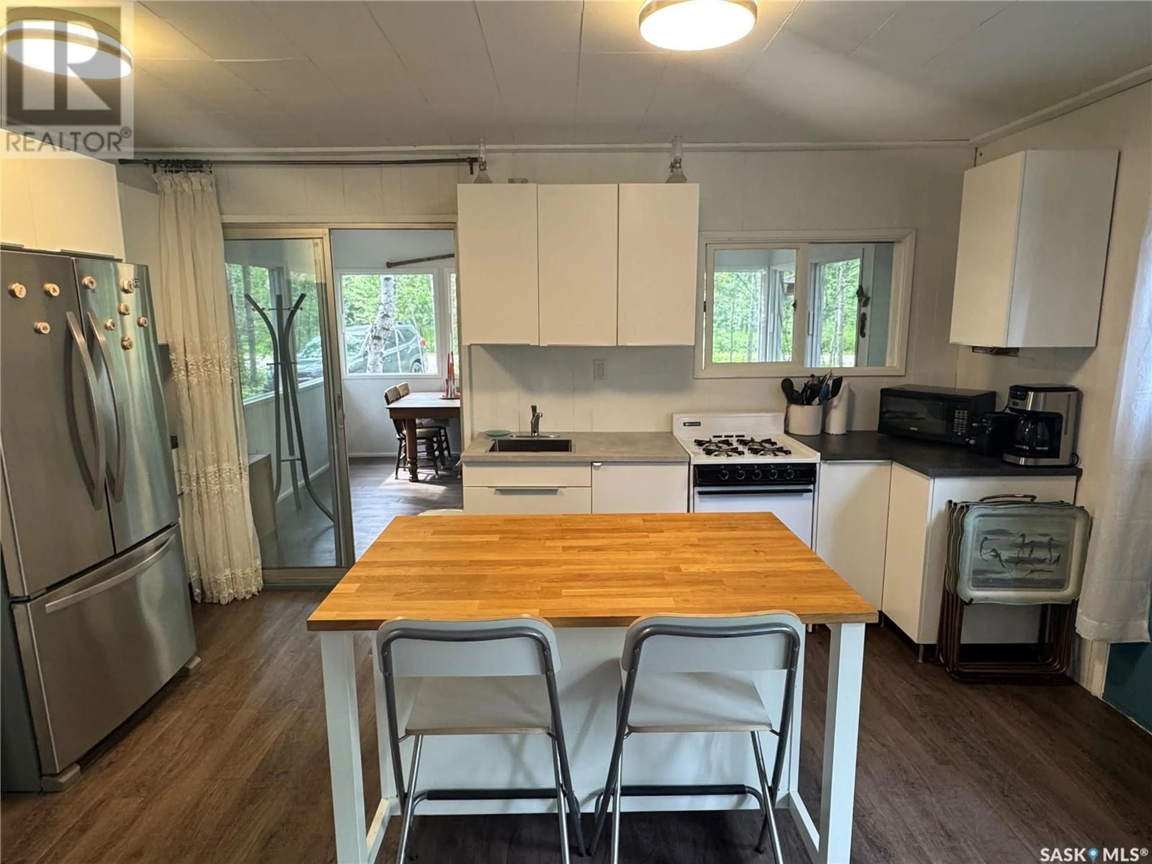 Open concept kitchen, wood/laminate floor for 1504 SPRUCE STREET, Northern Admin District Saskatchewan S0J1L0