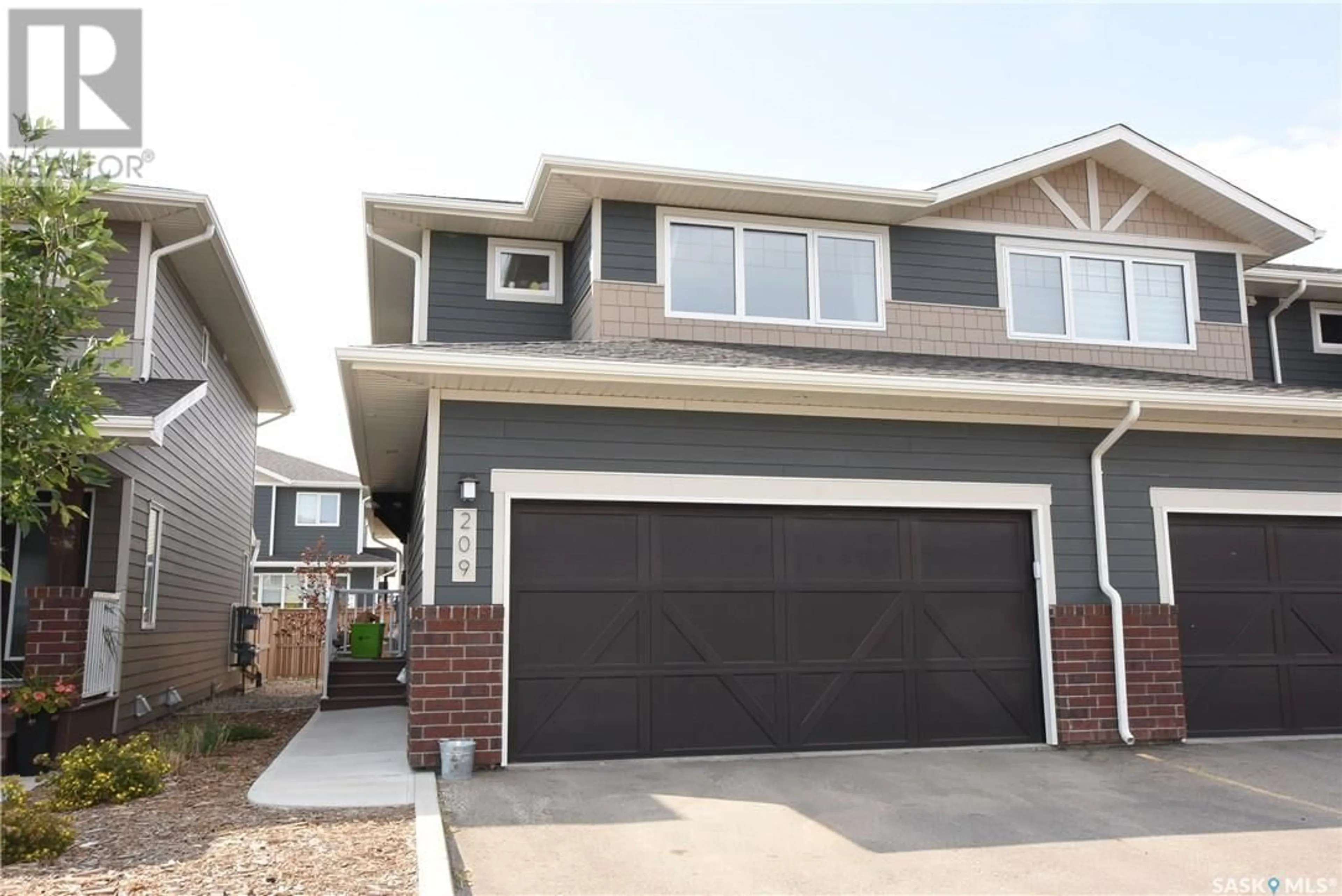 Home with vinyl exterior material, street for 209 - 4002 SANDHILL CRESCENT, Regina Saskatchewan S4V3J1