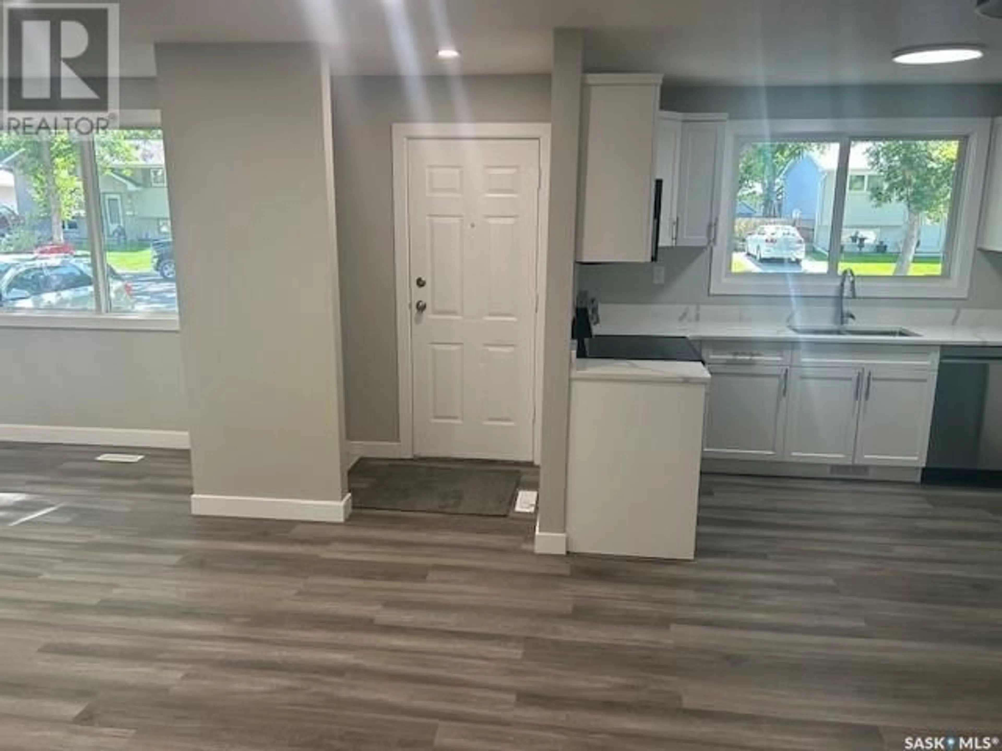 Open concept kitchen, wood/laminate floor for 10 FISHER STREET, Regina Saskatchewan S4N1N6
