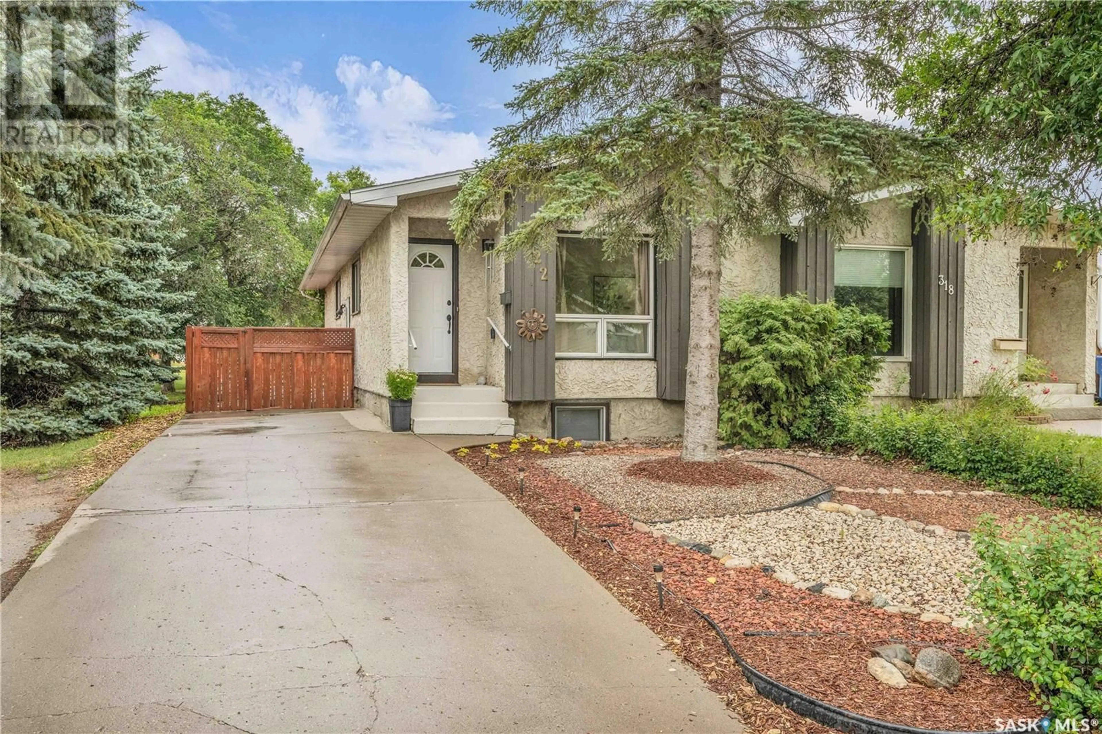 Home with vinyl exterior material, street for 322 MARKWELL DRIVE, Regina Saskatchewan S4X1N1
