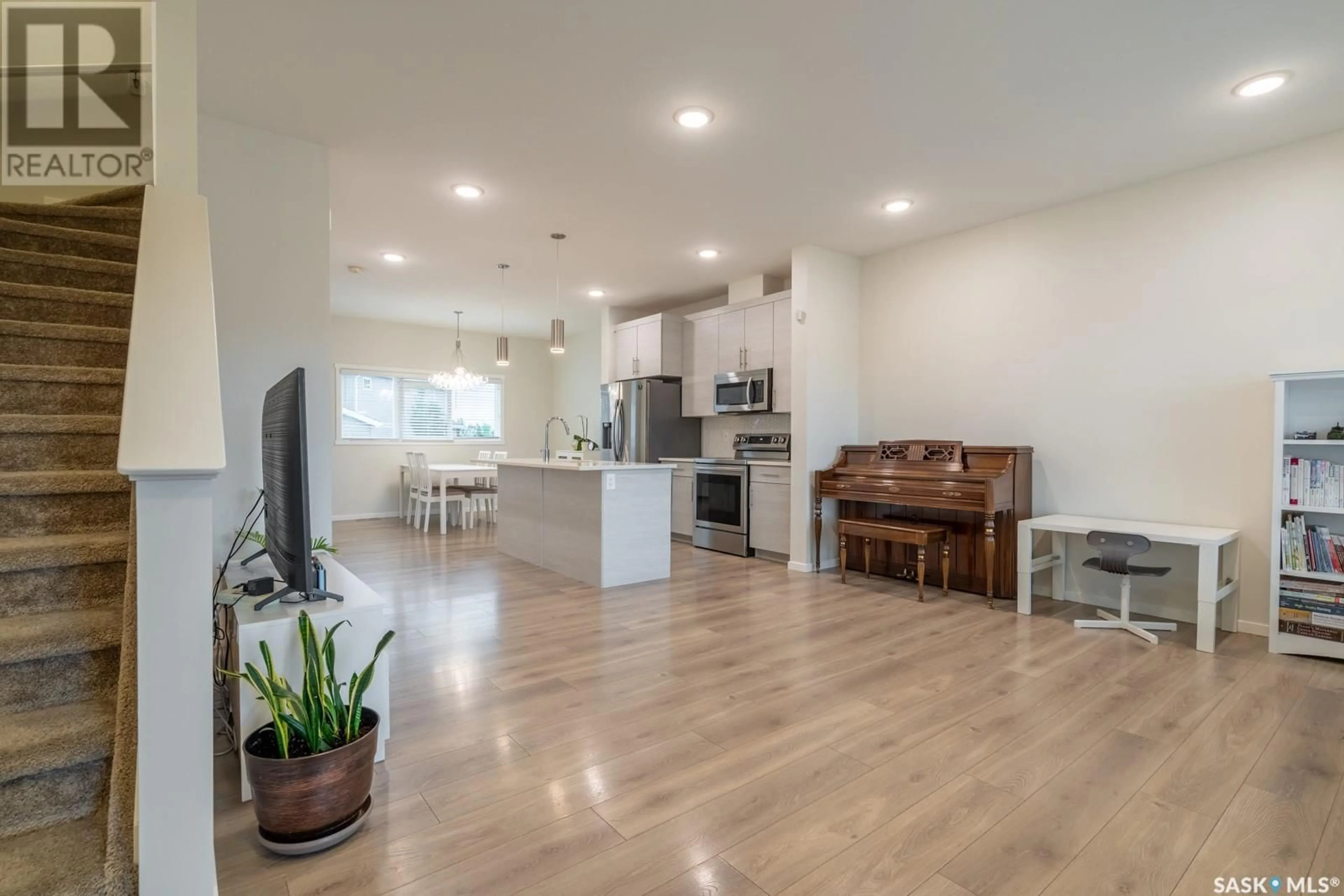 Open concept kitchen, wood/laminate floor for 5008 PRIMROSE GREEN DRIVE, Regina Saskatchewan S4V3S5
