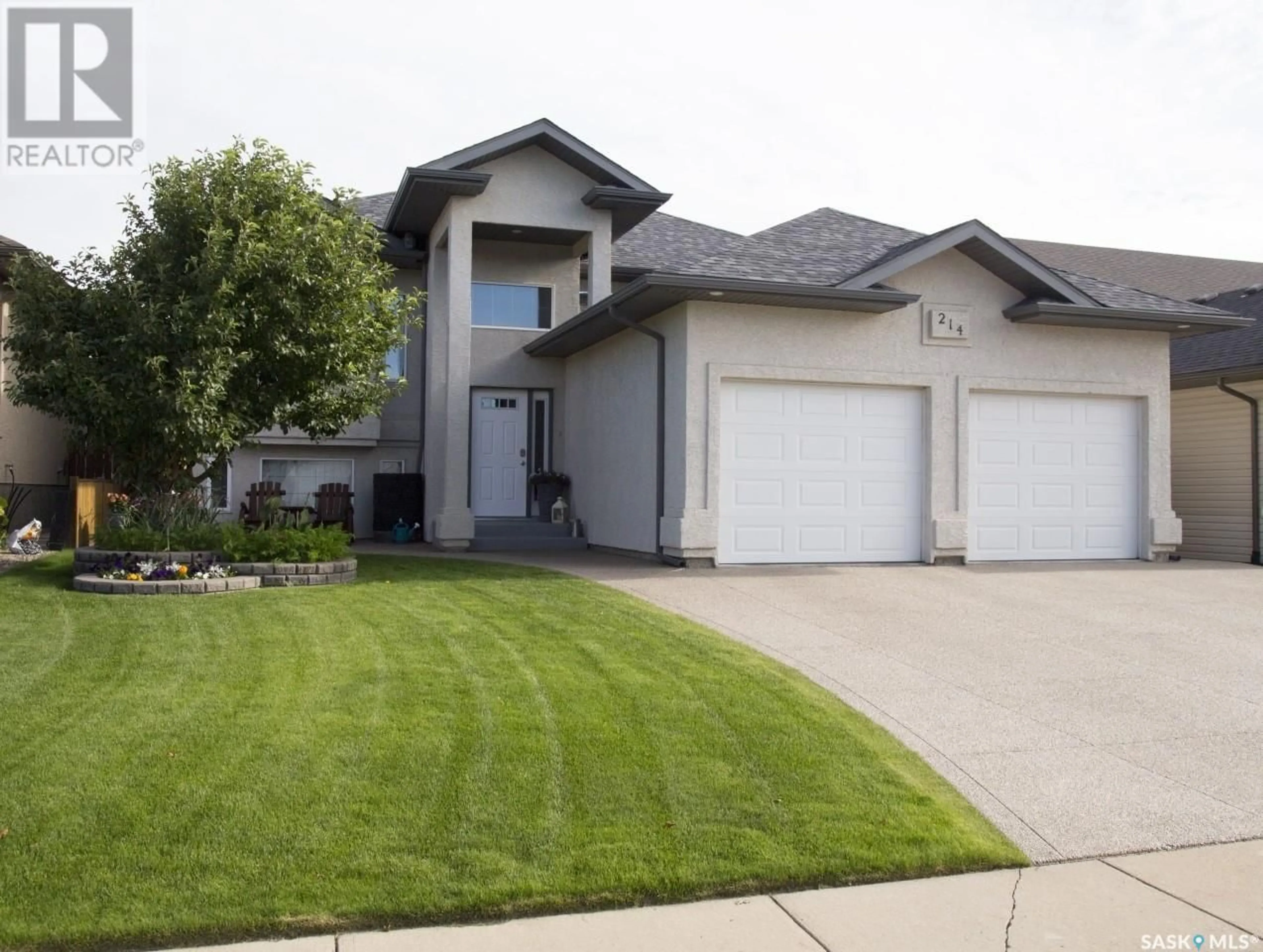 Home with vinyl exterior material, street for 214 CRENSHAW WAY, Warman Saskatchewan S0K4S1
