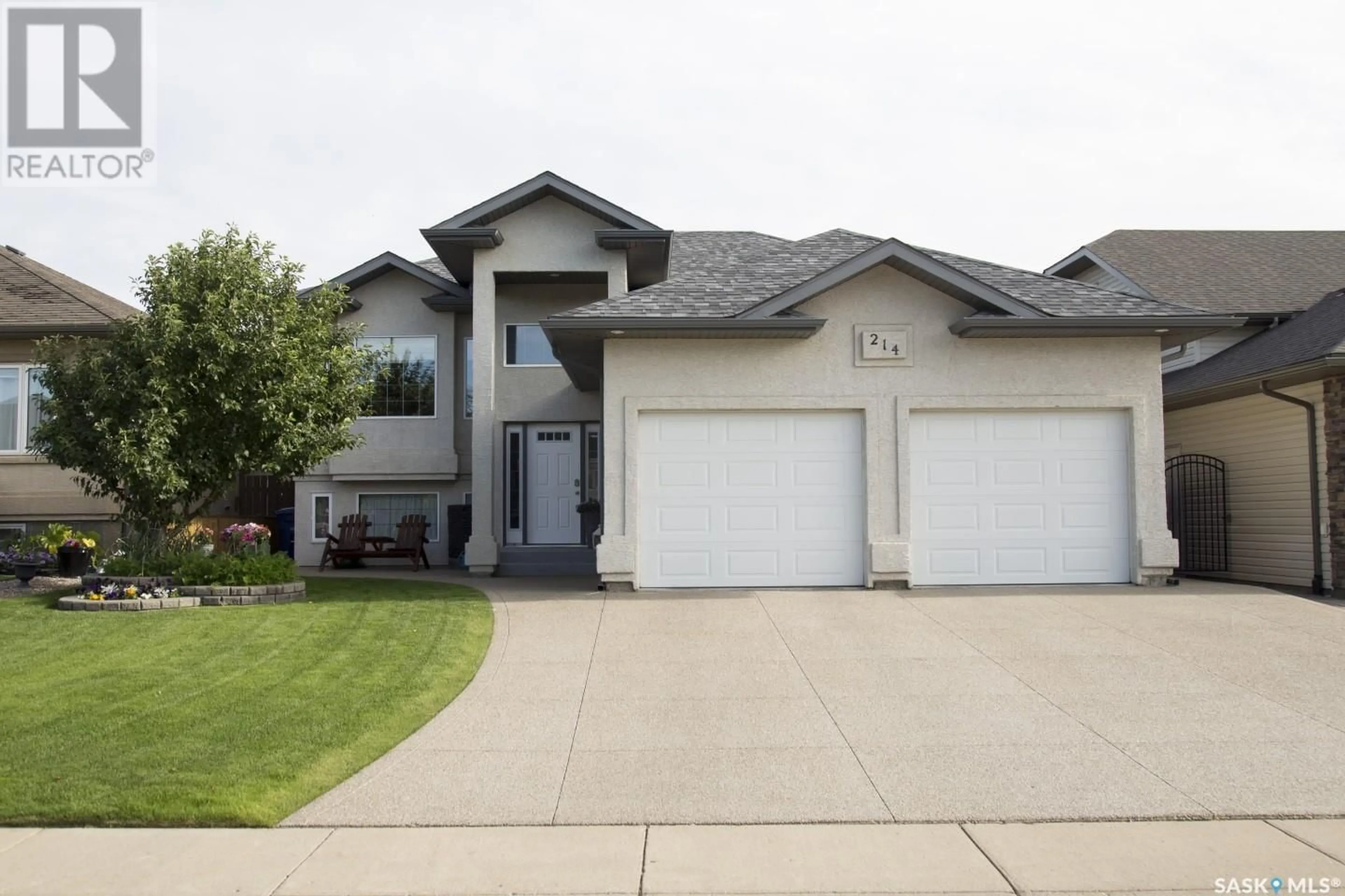 Home with vinyl exterior material, street for 214 CRENSHAW WAY, Warman Saskatchewan S0K4S1