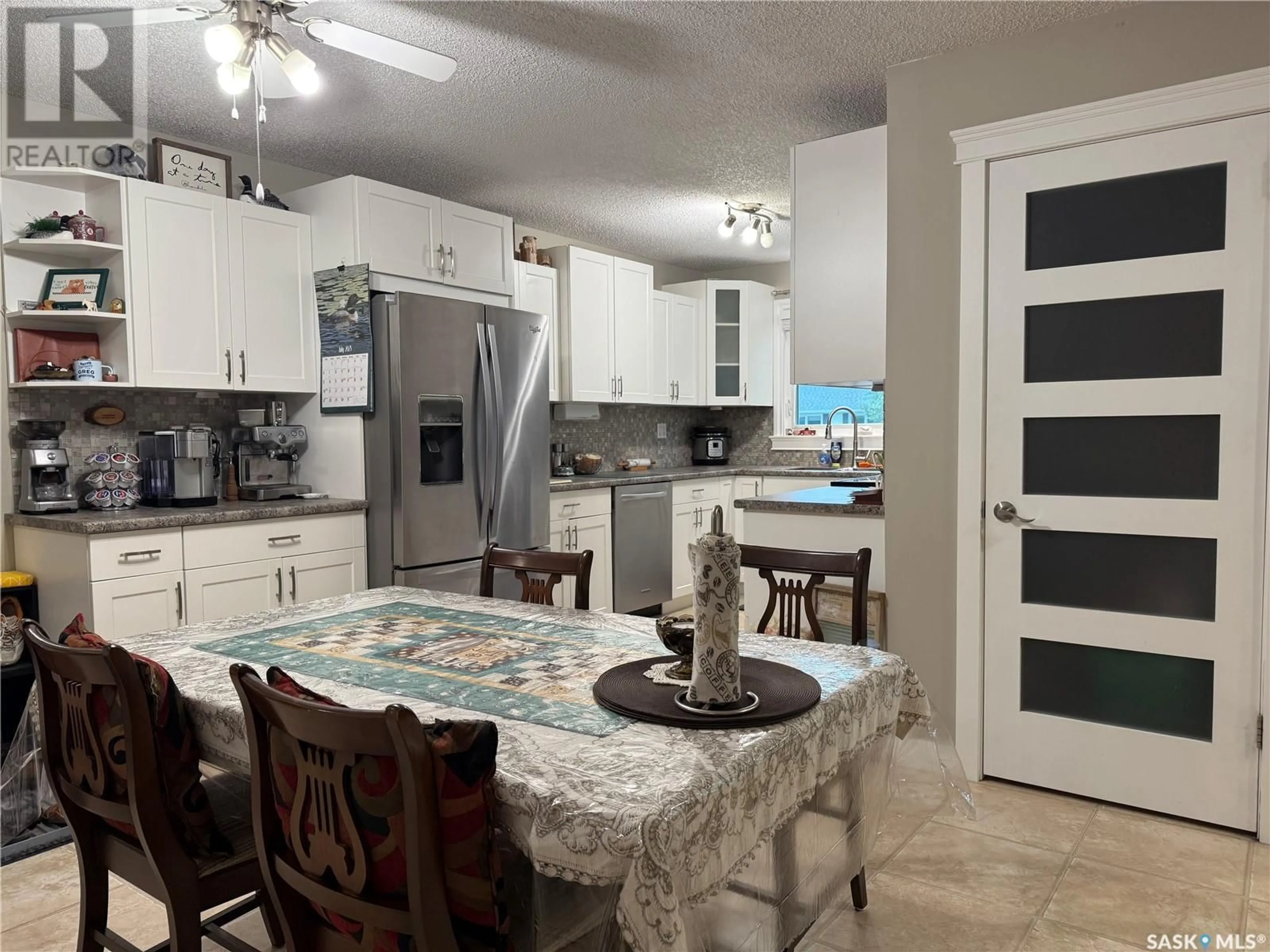 Open concept kitchen, ceramic/tile floor for 21 CENTENNIAL CRESCENT, Humboldt Saskatchewan S0K2A0