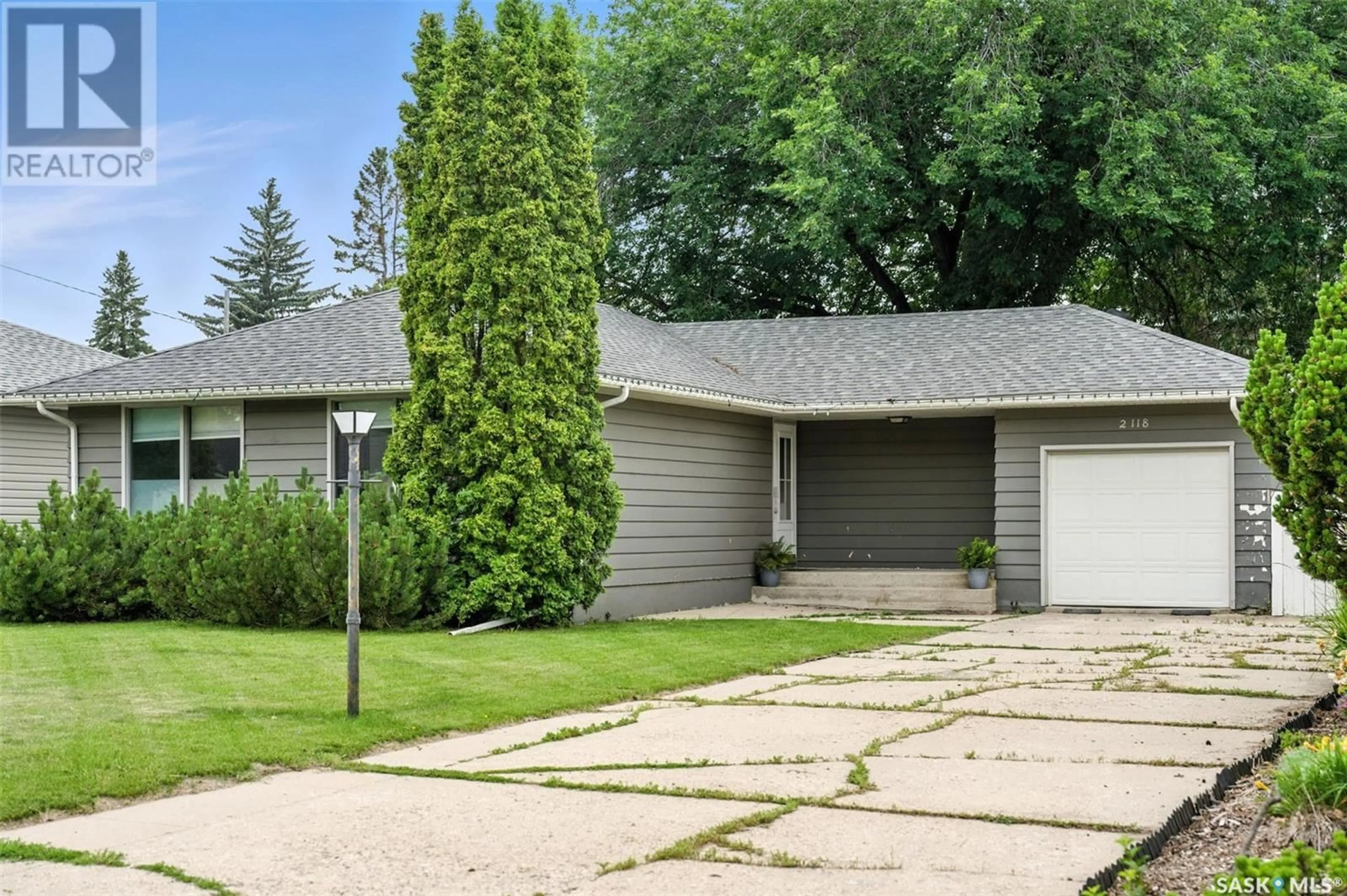 Home with vinyl exterior material, street for 2118 HAULTAIN AVENUE, Saskatoon Saskatchewan S7J1P6