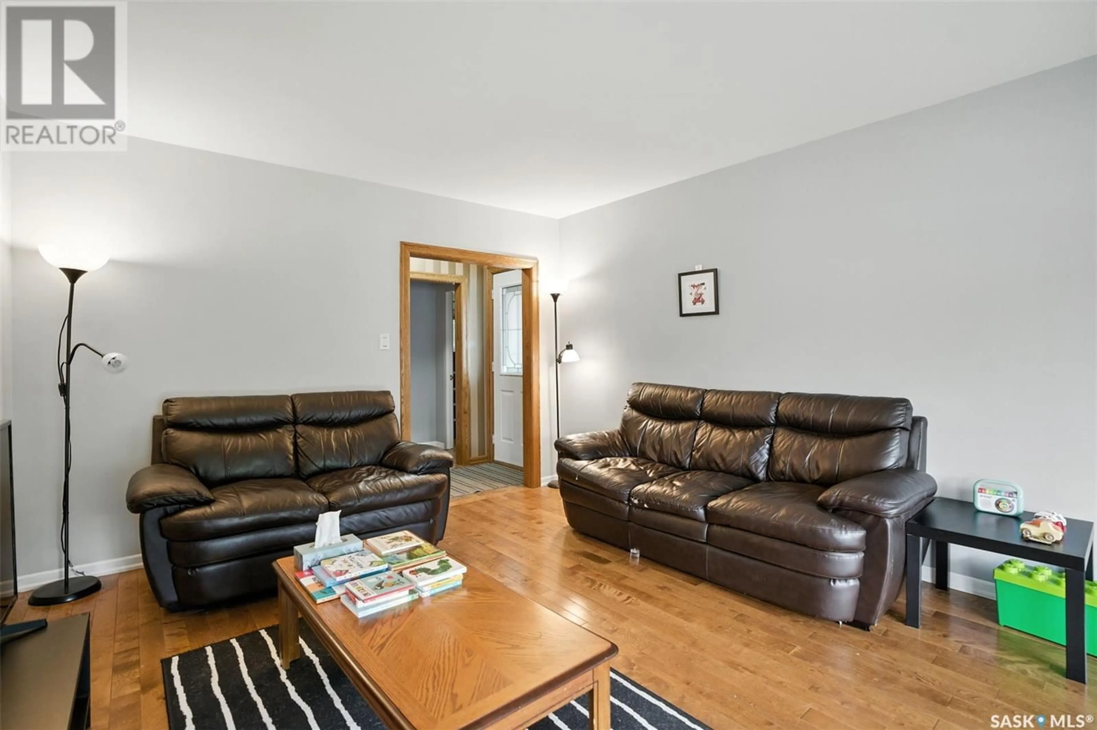 Living room with furniture, wood/laminate floor for 2118 HAULTAIN AVENUE, Saskatoon Saskatchewan S7J1P6
