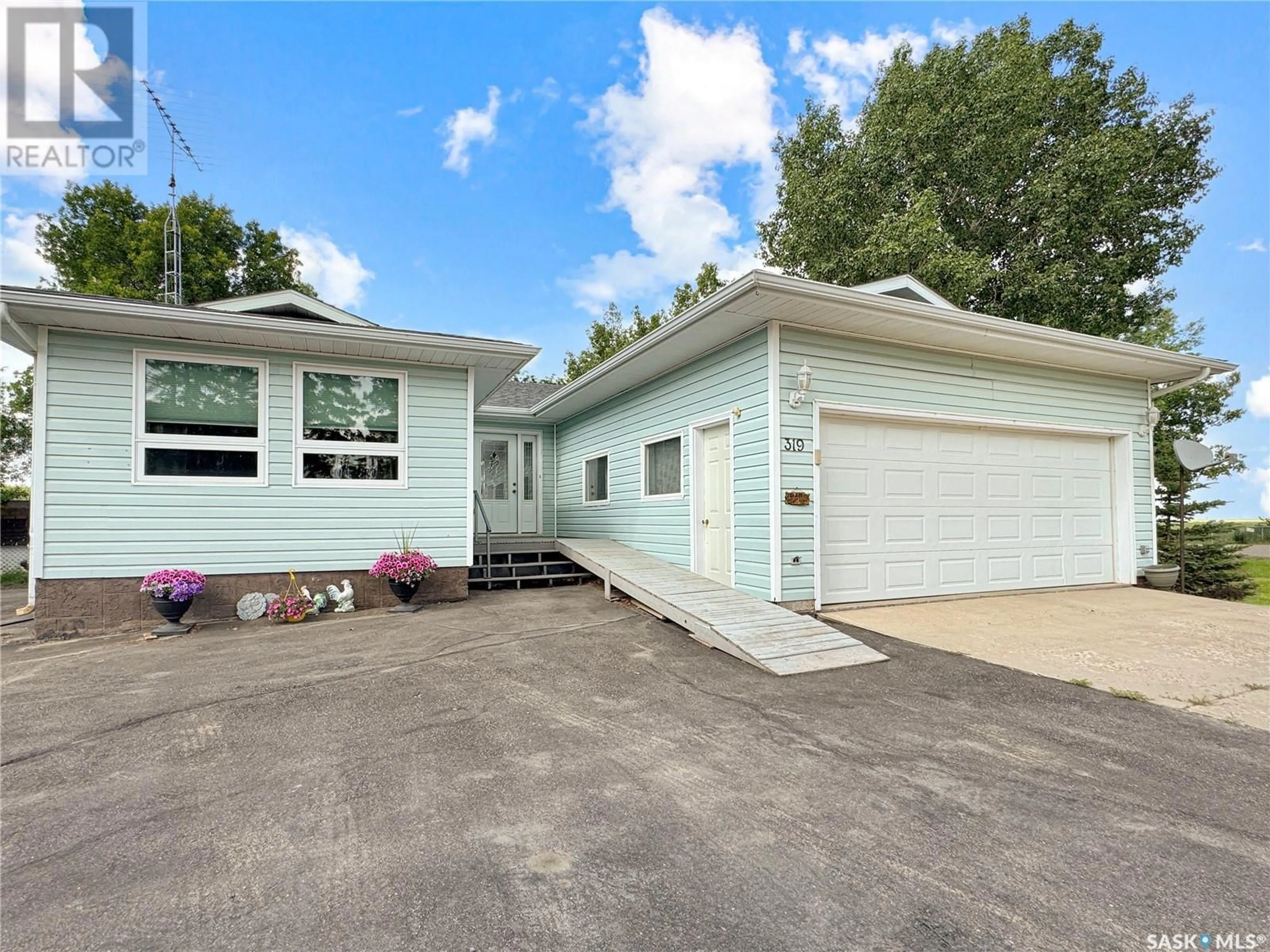 Home with vinyl exterior material, street for 319 FINLEY AVENUE, Cut Knife Saskatchewan S0M0N0