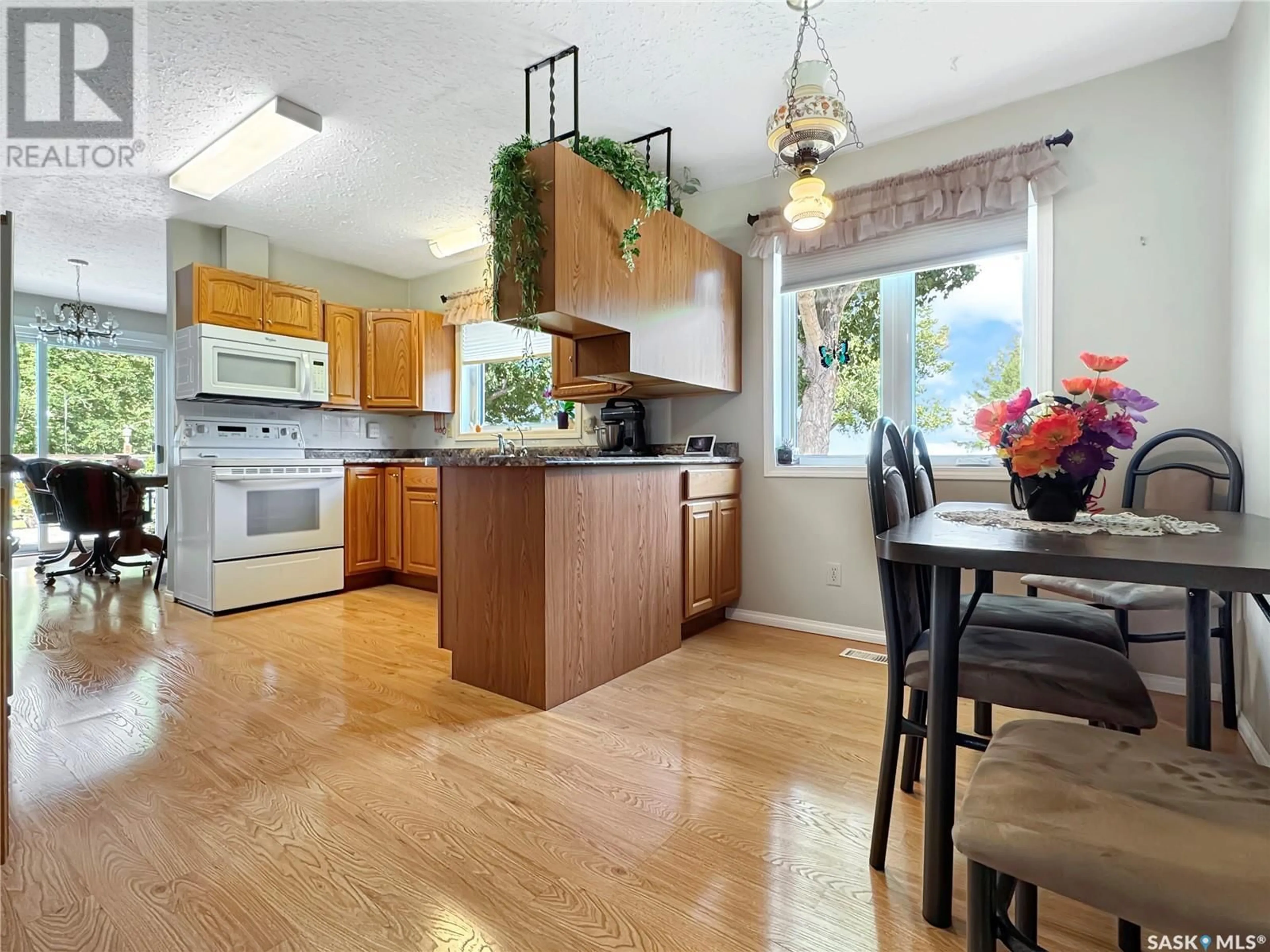 Open concept kitchen, wood/laminate floor for 319 FINLEY AVENUE, Cut Knife Saskatchewan S0M0N0