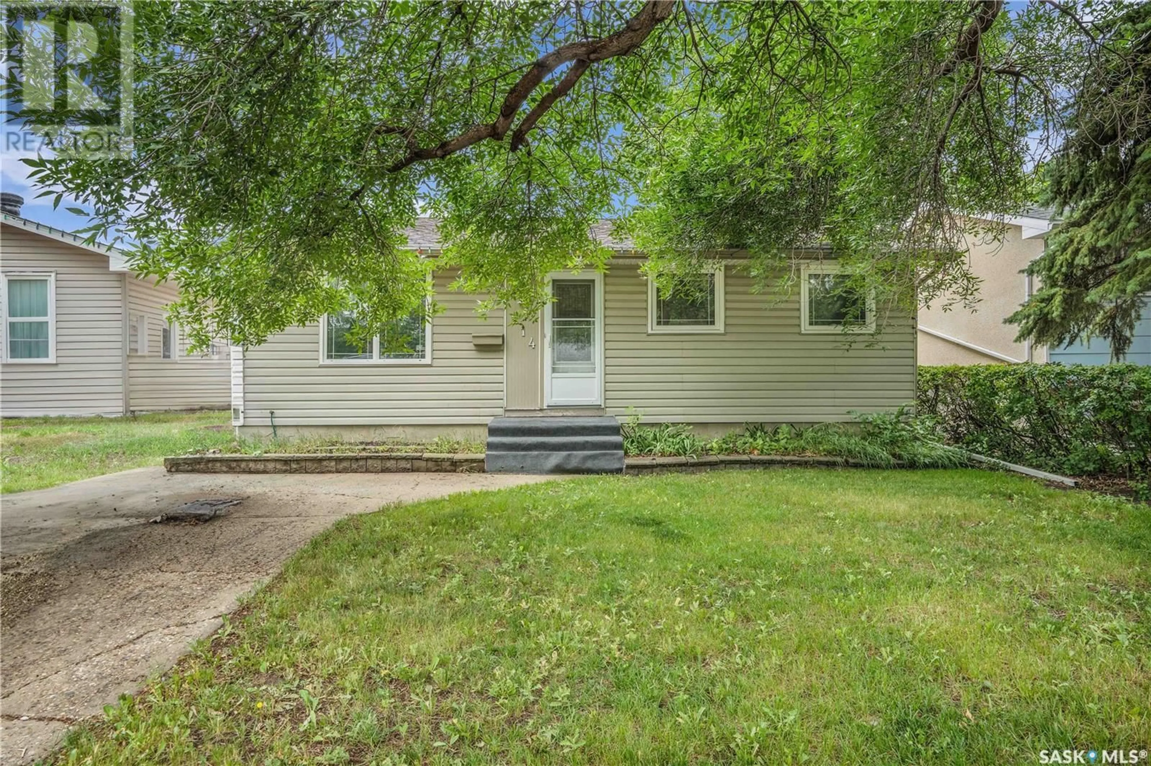 Home with vinyl exterior material, street for 214 TRUDELLE CRESCENT, Regina Saskatchewan S4T6T4