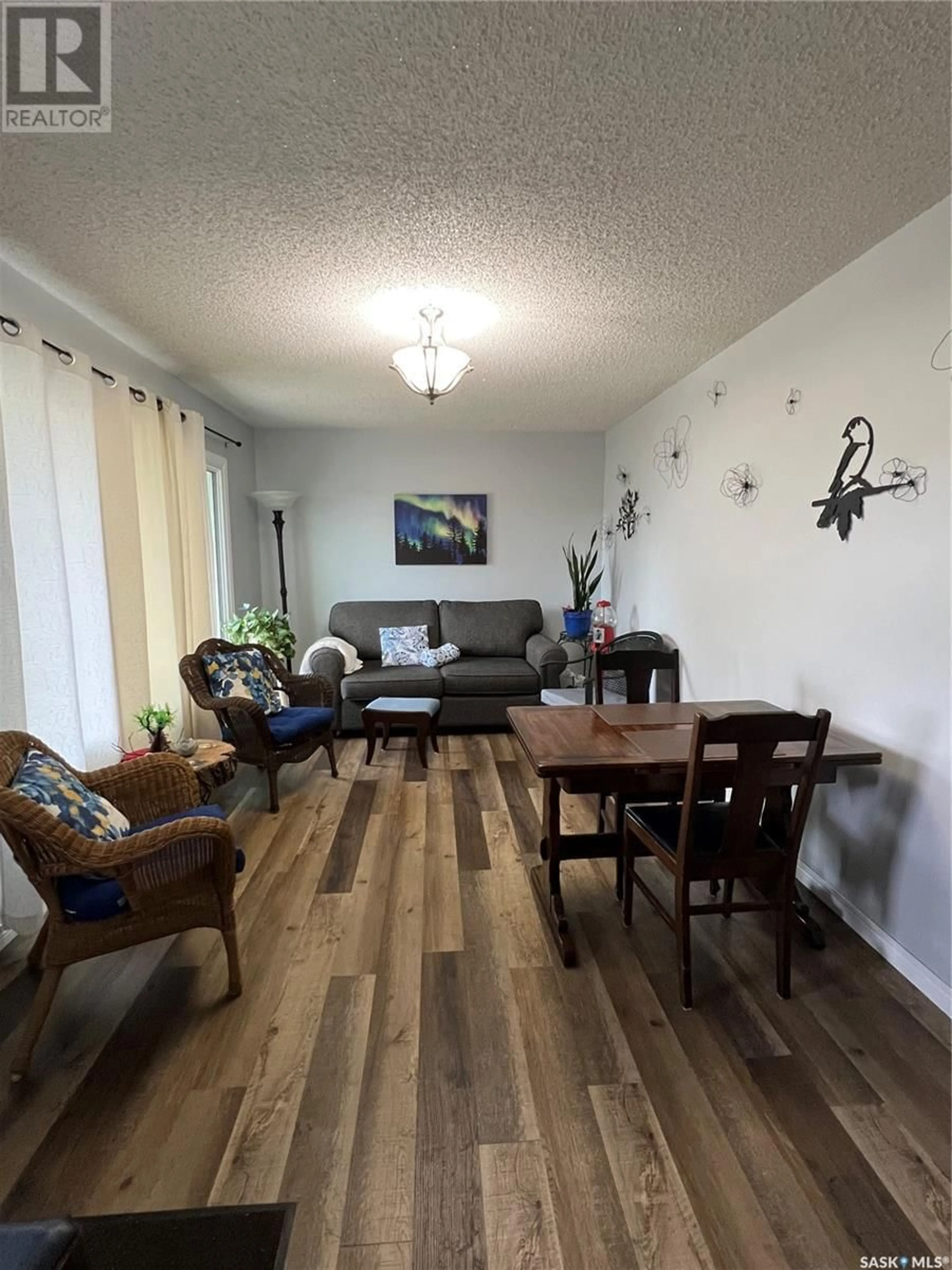 Living room with furniture, wood/laminate floor for 250 5TH STREET, Wadena Saskatchewan S0A4J0