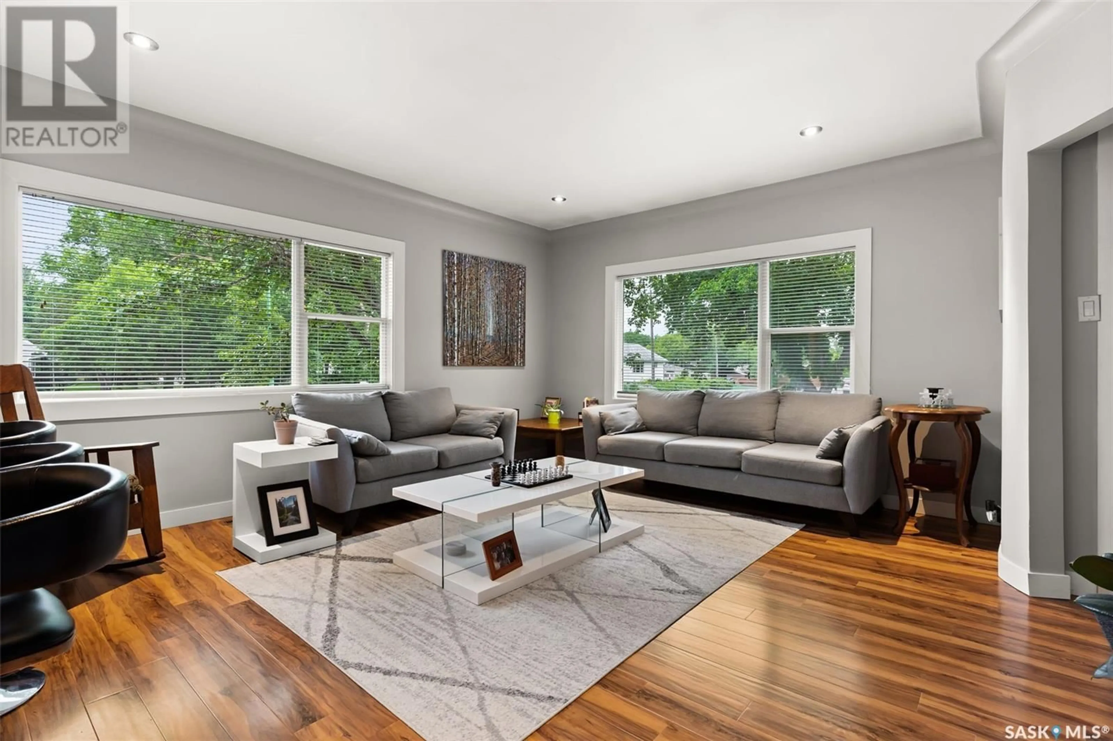 Living room with furniture, wood/laminate floor for 3802 20TH AVENUE, Regina Saskatchewan S4S0P4
