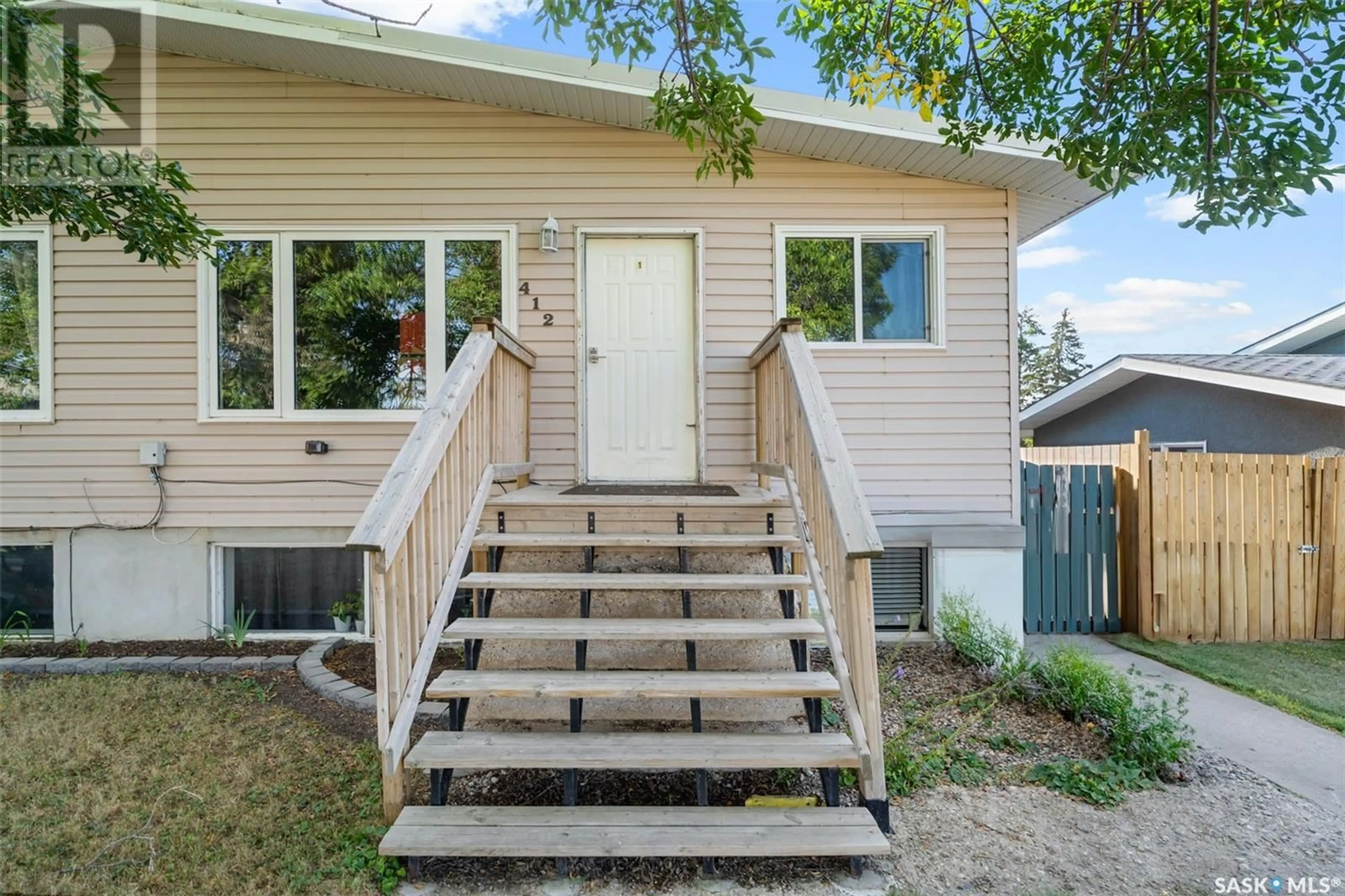 Home with vinyl exterior material, street for E - 410 - 412 3RD STREET, Delisle Saskatchewan S0L0P0