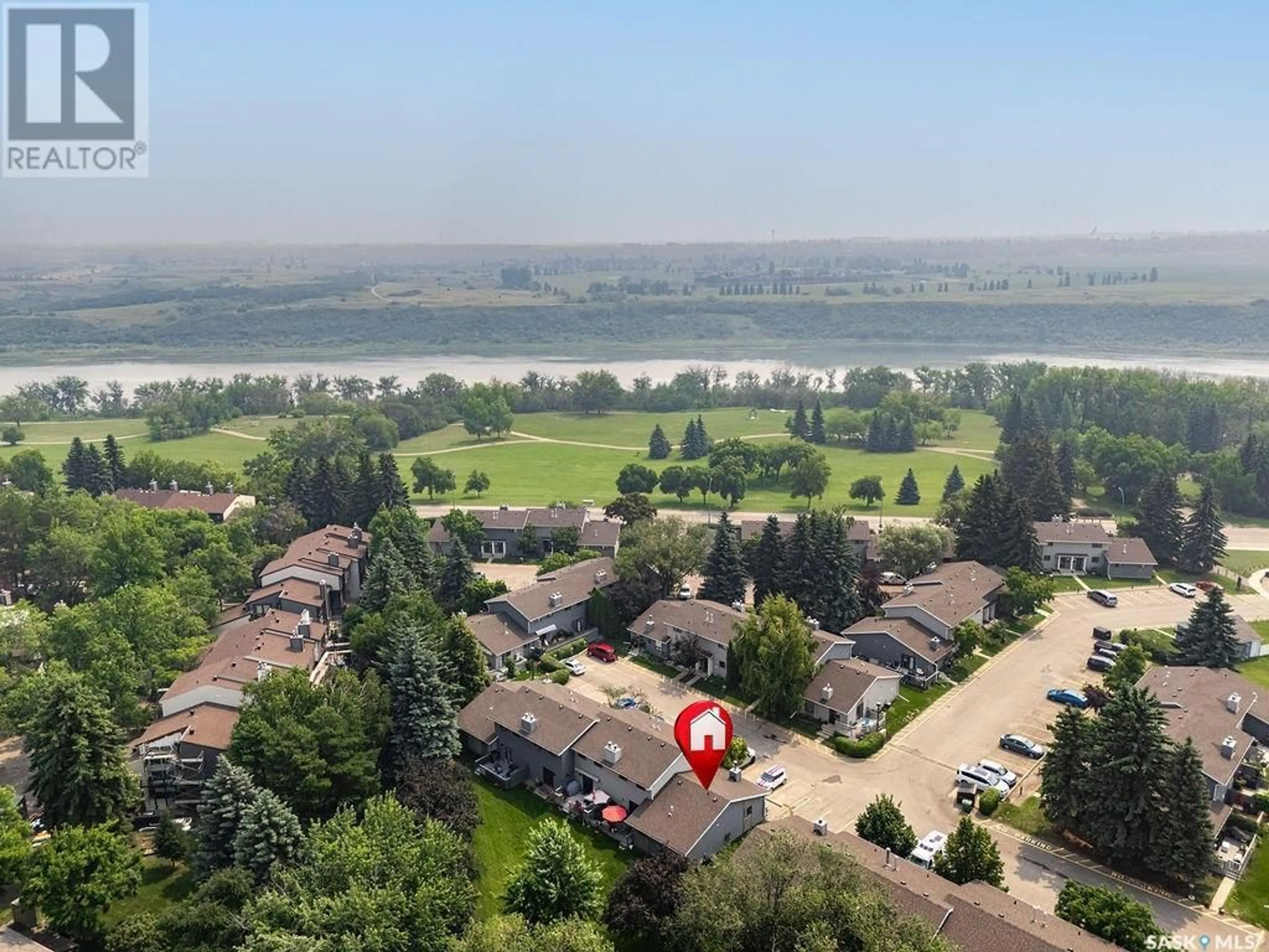A pic from outside/outdoor area/front of a property/back of a property/a pic from drone, water/lake/river/ocean view for 501 145 SANDY COURT, Saskatoon Saskatchewan S7K6P8