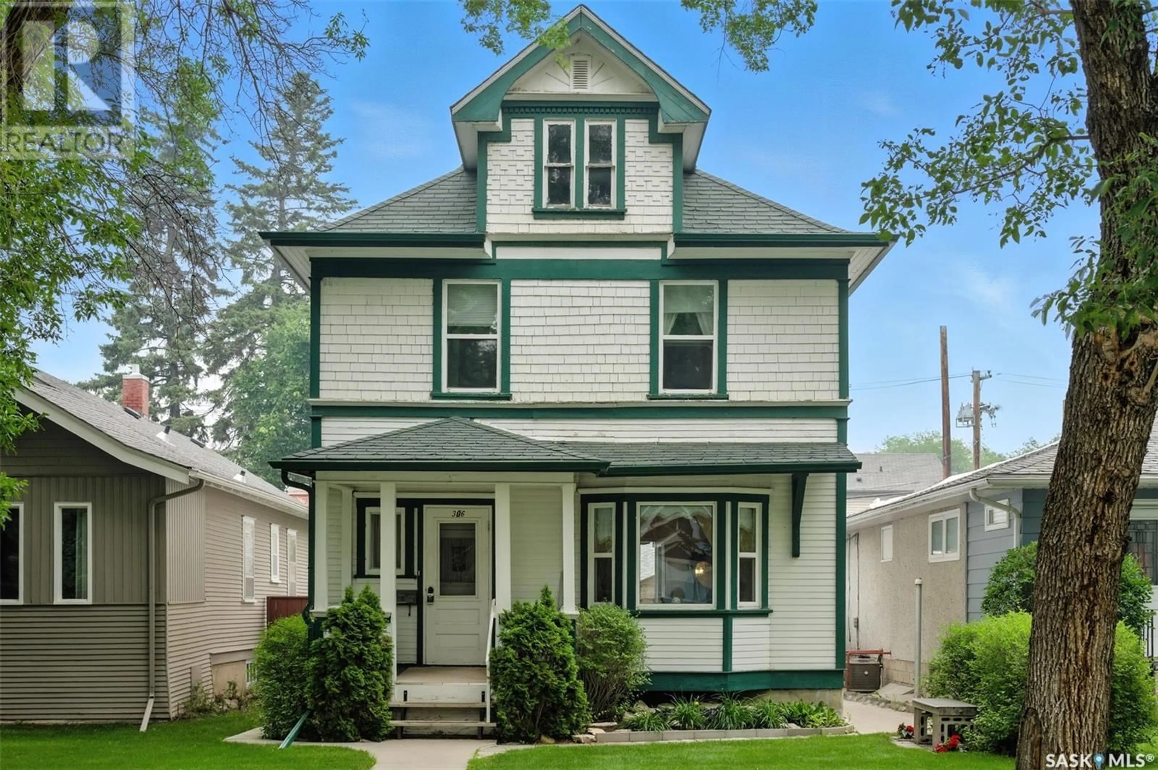 Home with vinyl exterior material, street for 306 31ST STREET, Saskatoon Saskatchewan S7L0P9