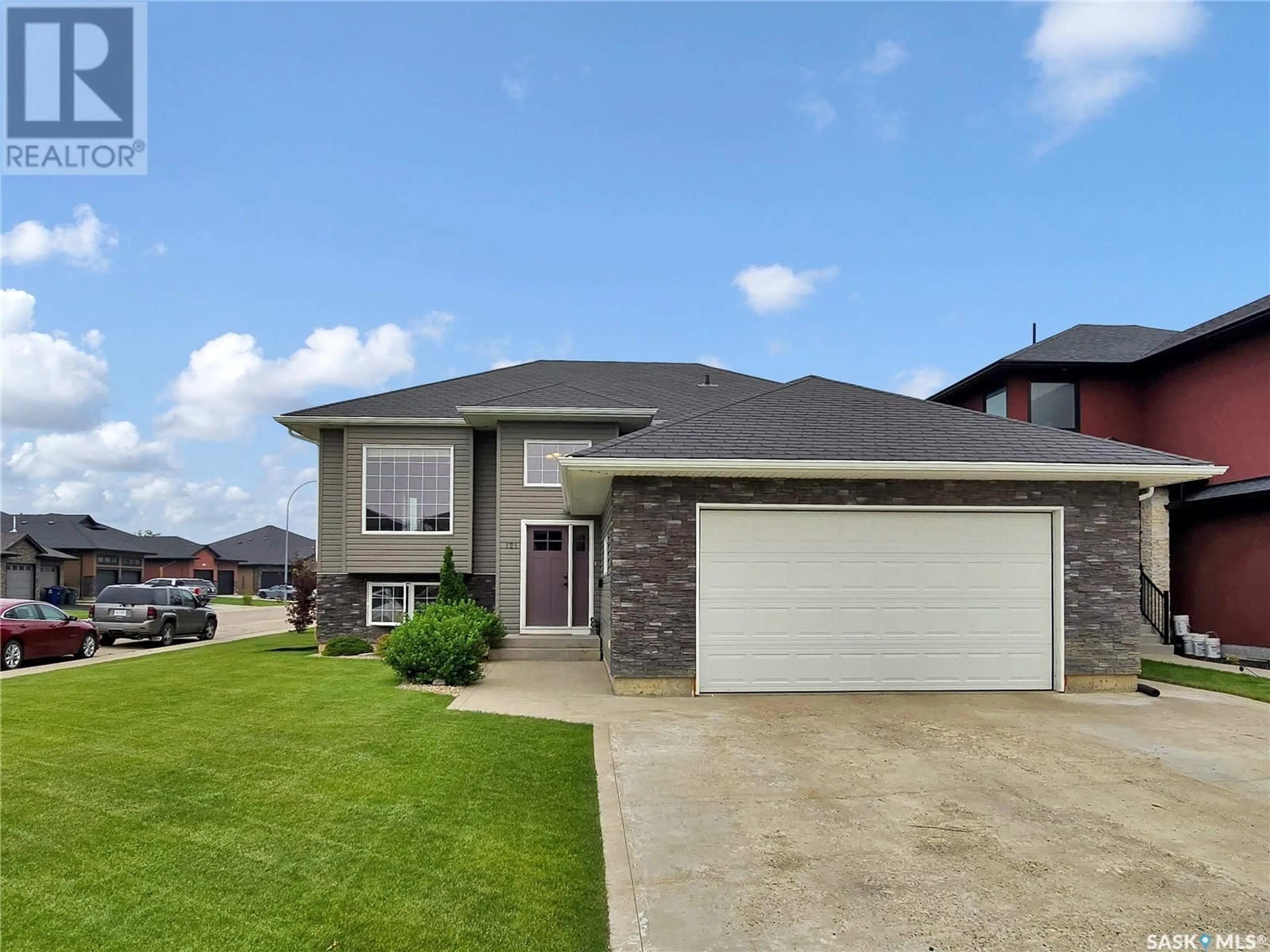 Home with brick exterior material, street for 121 KINSMEN CRESCENT, Martensville Saskatchewan S0K0A2