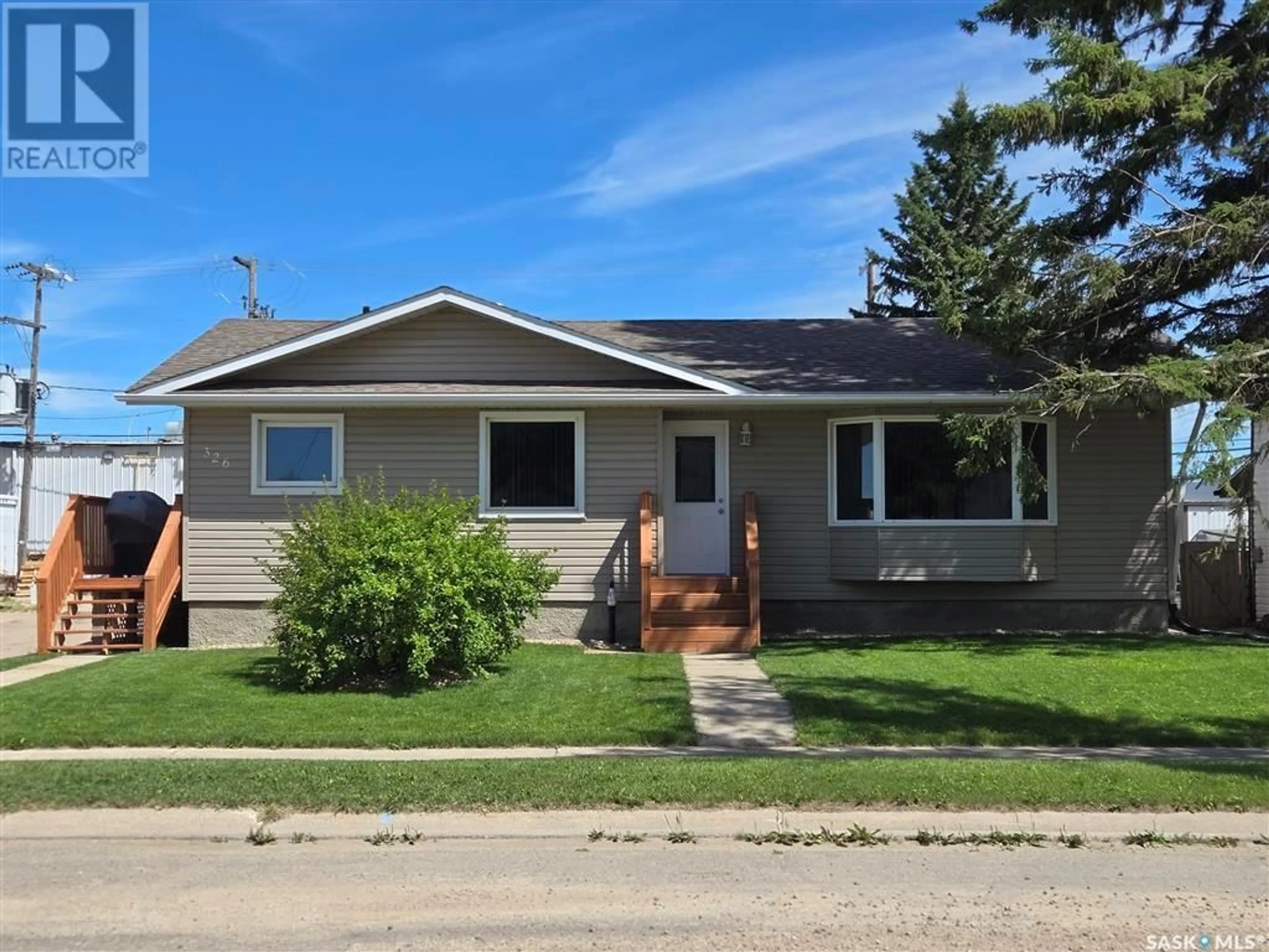 Home with vinyl exterior material, street for 326 9TH STREET, Humboldt Saskatchewan S0K2A0