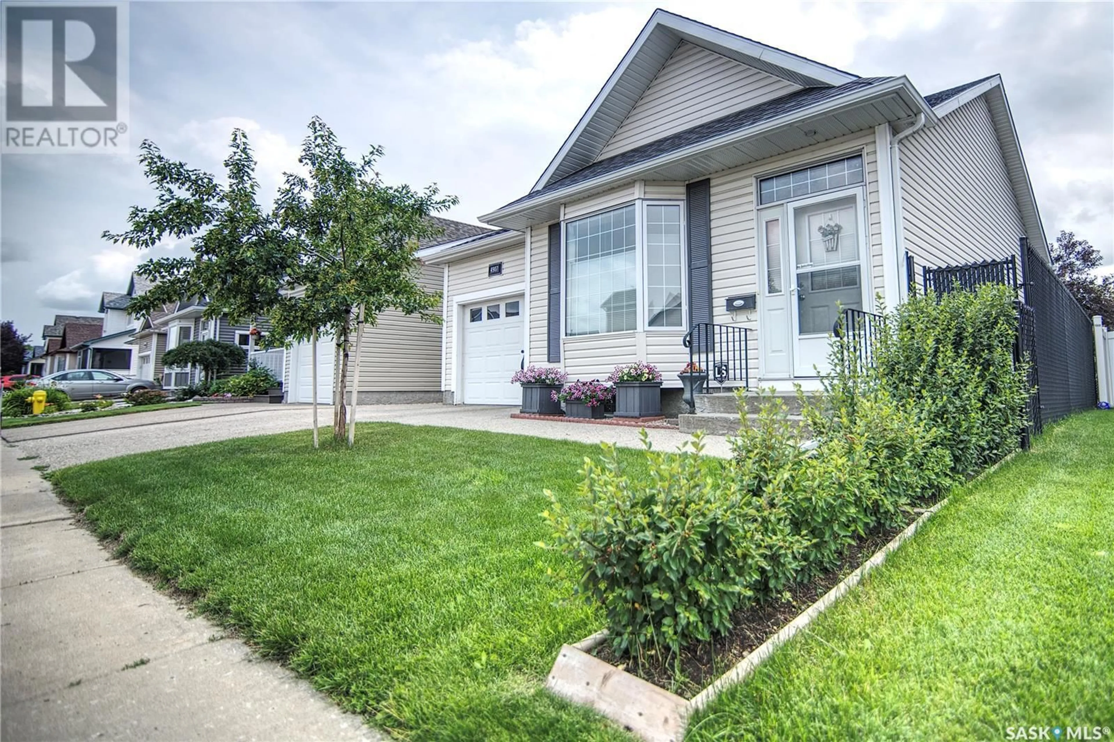 Home with vinyl exterior material, street for 4907 JUNIPER DRIVE, Regina Saskatchewan S4X4N8