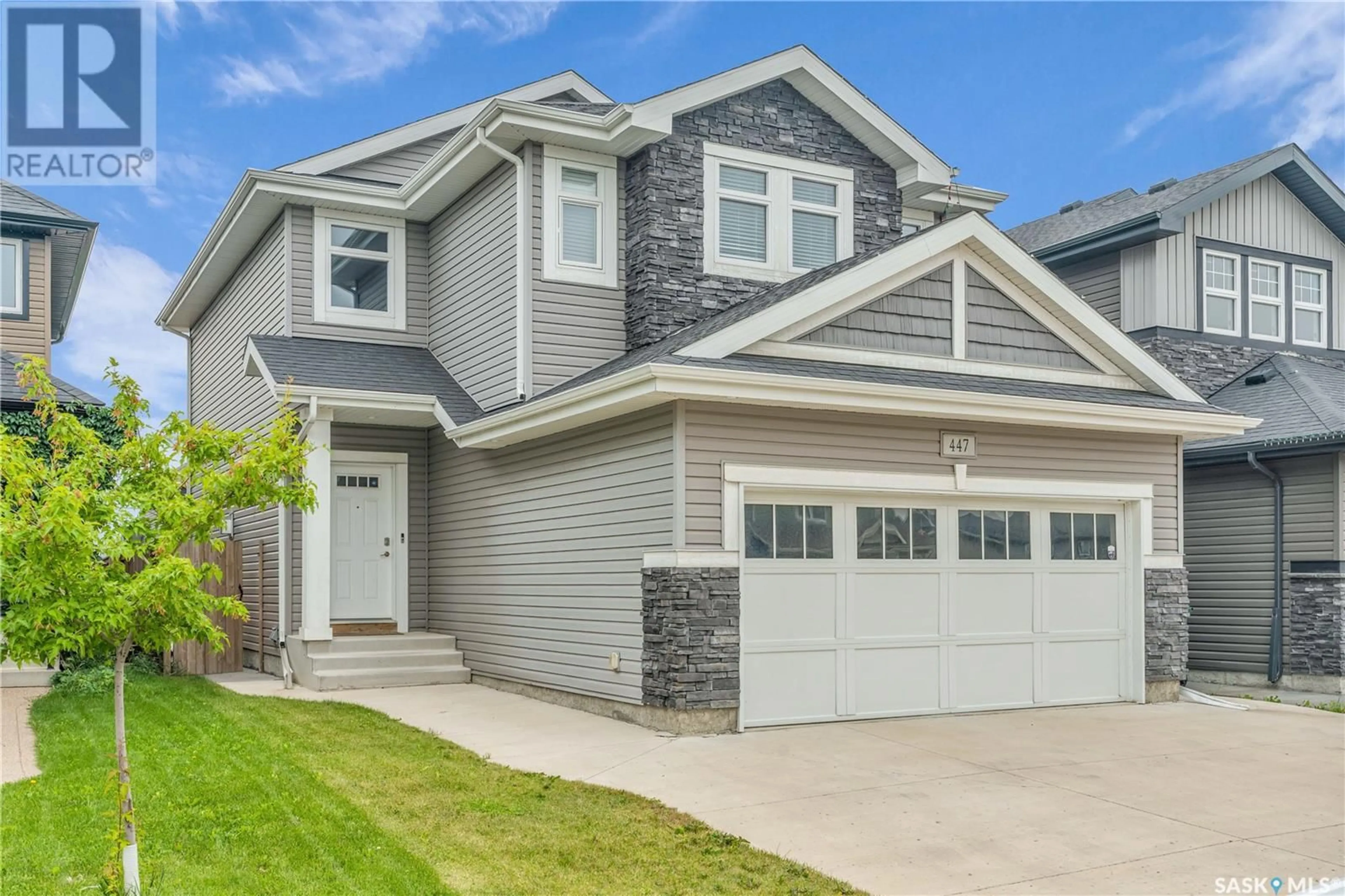Home with vinyl exterior material, street for 447 VELTKAMP CRESCENT, Saskatoon Saskatchewan S7T0E5