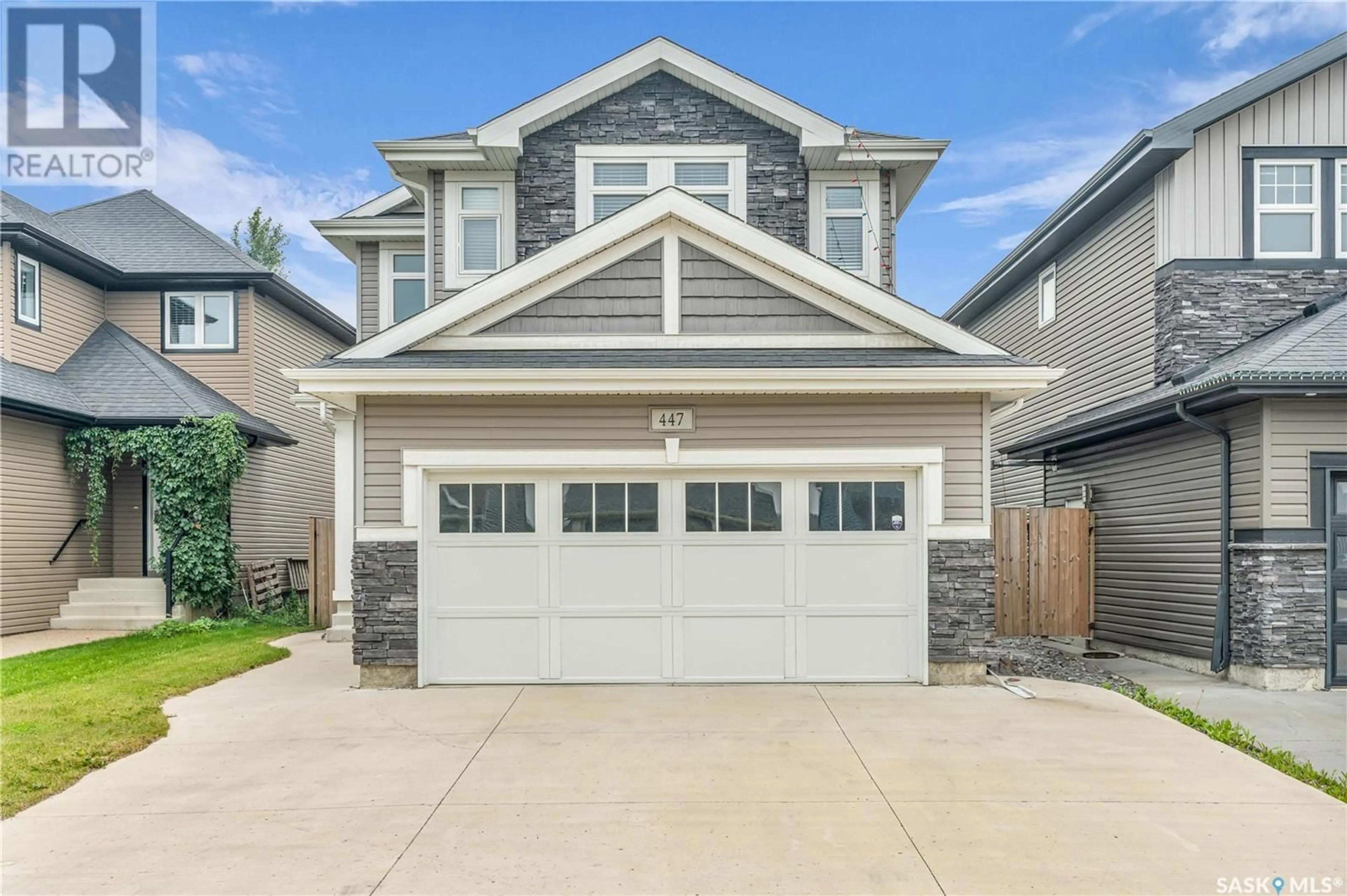 Home with vinyl exterior material, street for 447 VELTKAMP CRESCENT, Saskatoon Saskatchewan S7T0E5