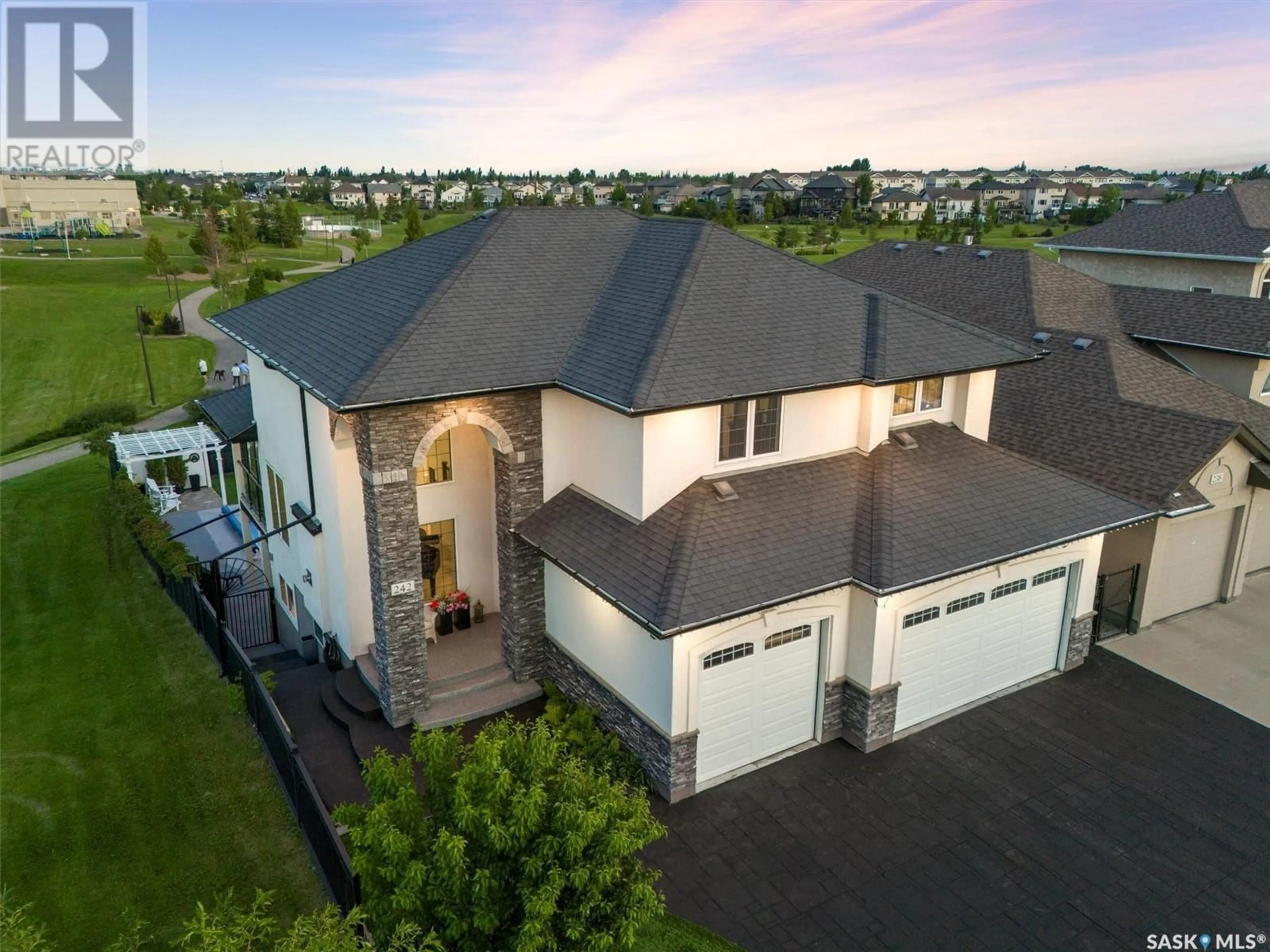 A pic from outside/outdoor area/front of a property/back of a property/a pic from drone, unknown for 242 ADDISON ROAD, Saskatoon Saskatchewan S7W1B9