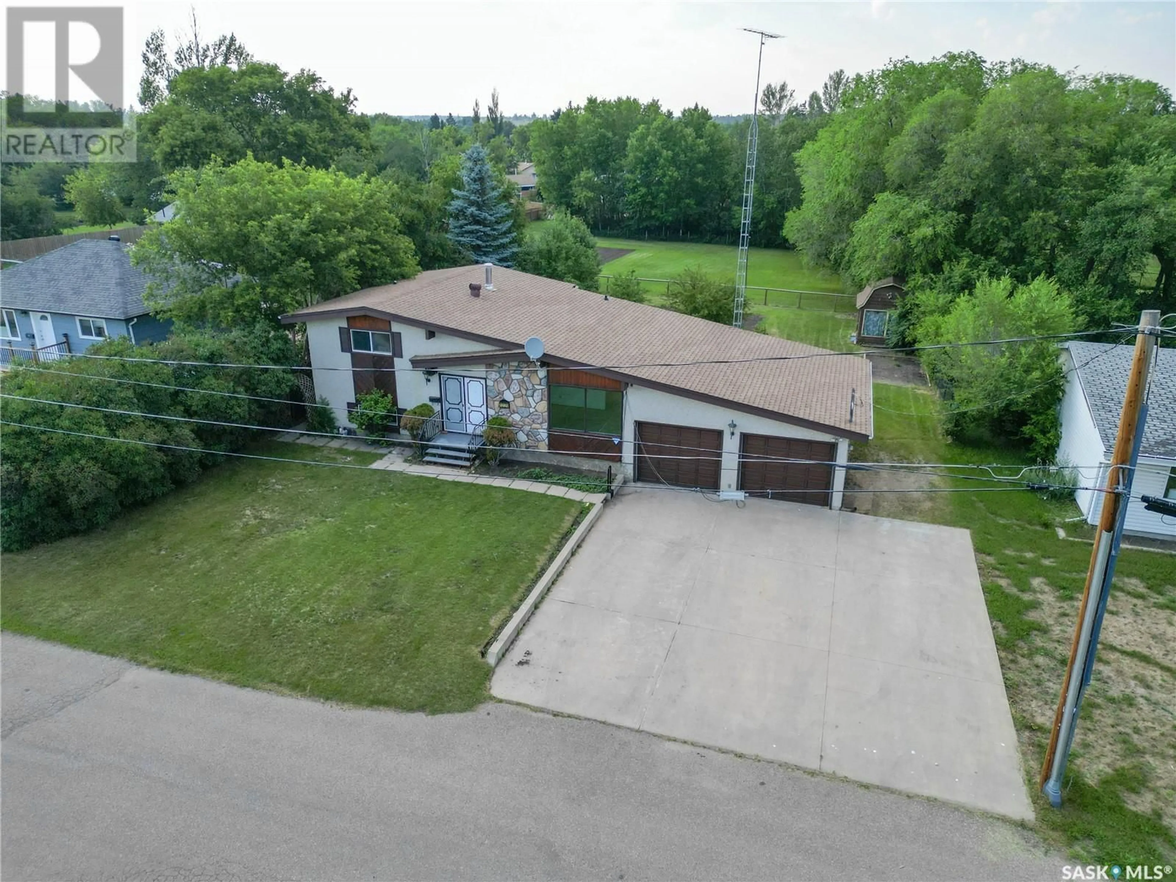 A pic from outside/outdoor area/front of a property/back of a property/a pic from drone, street for 1220 6TH STREET, Prince Albert Saskatchewan S6V0P7
