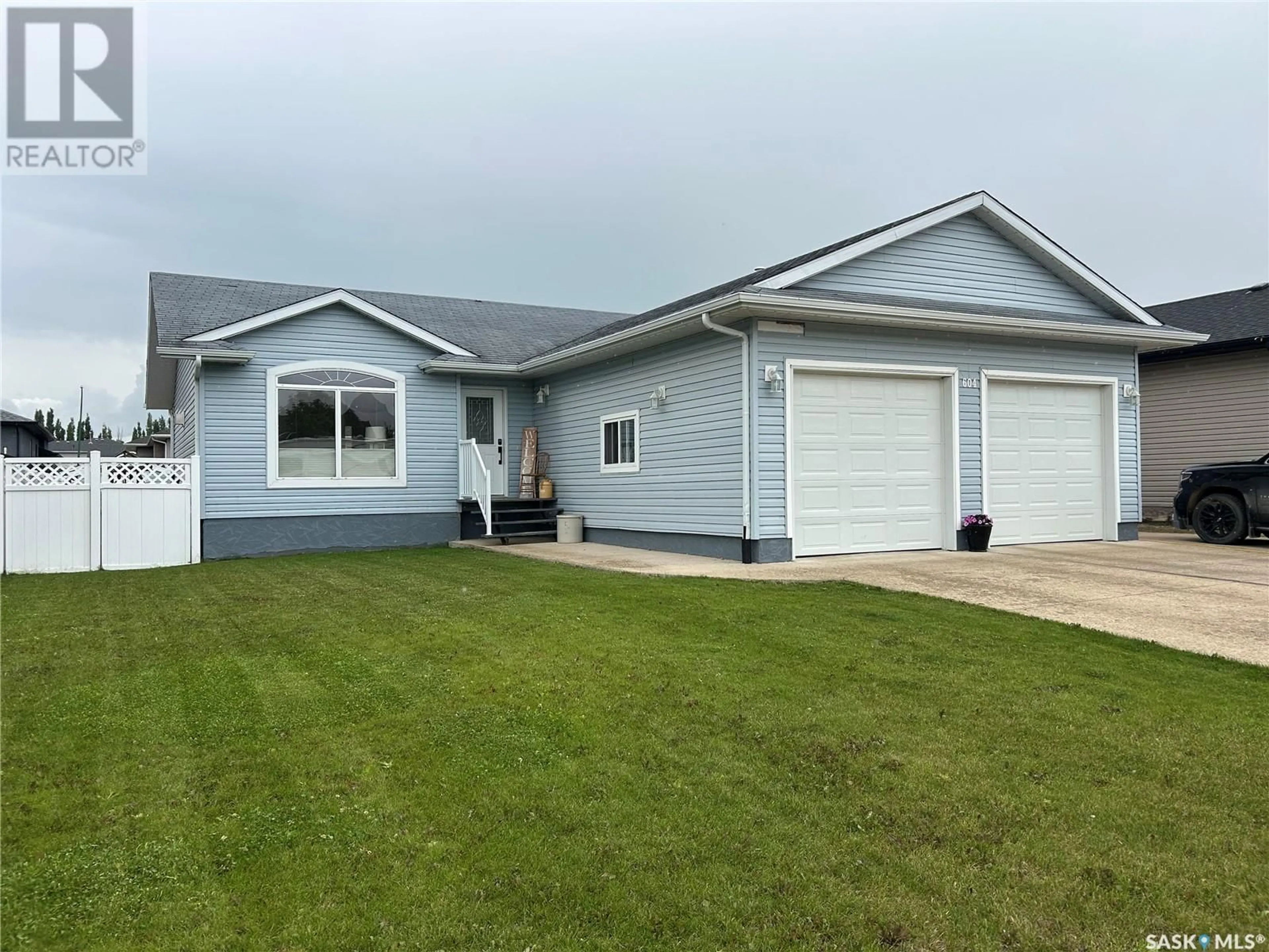 Home with vinyl exterior material, street for 604 FORESTER CRESCENT, Tisdale Saskatchewan S0E1T0