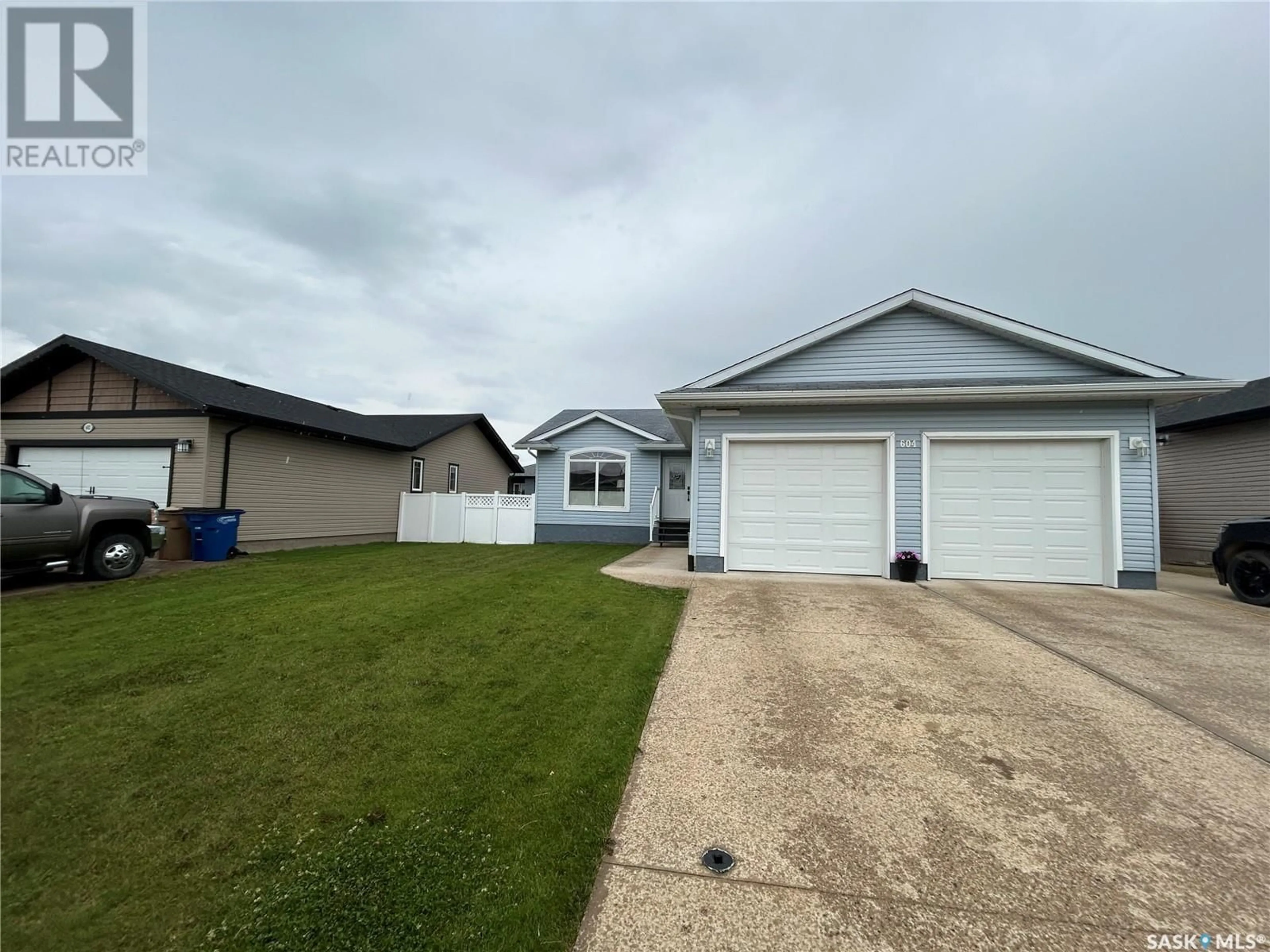 Home with vinyl exterior material, street for 604 FORESTER CRESCENT, Tisdale Saskatchewan S0E1T0
