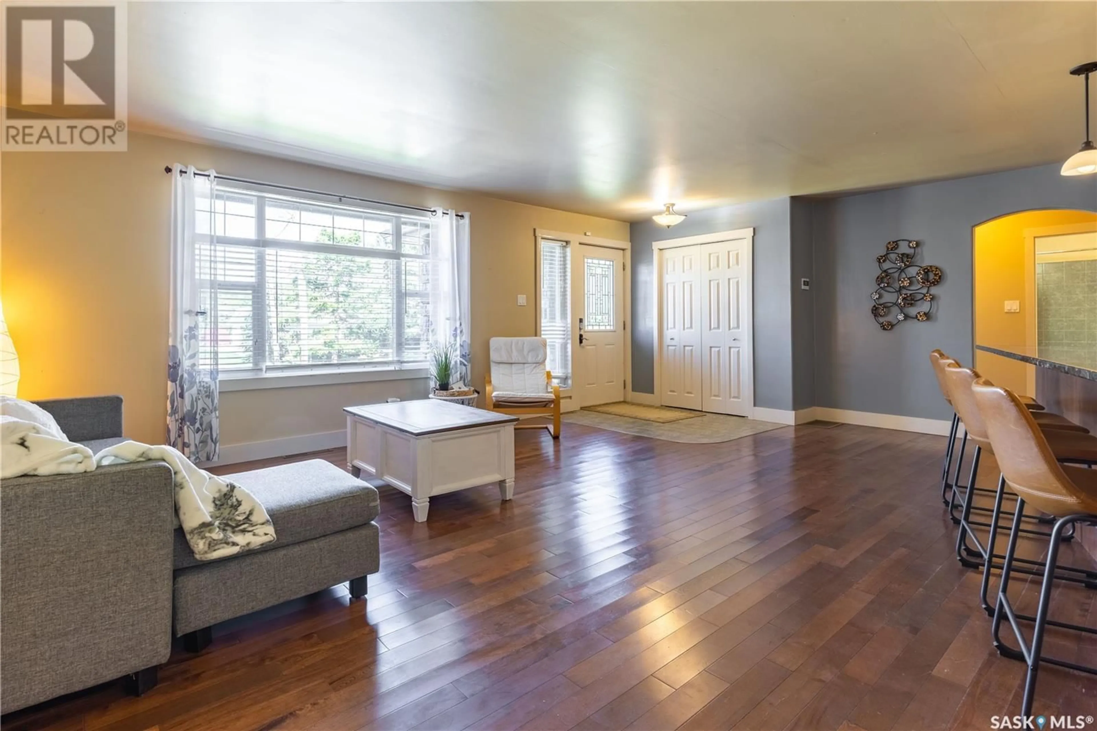 Living room with furniture, wood/laminate floor for 607 1ST STREET, Kenaston Saskatchewan S0G2N0