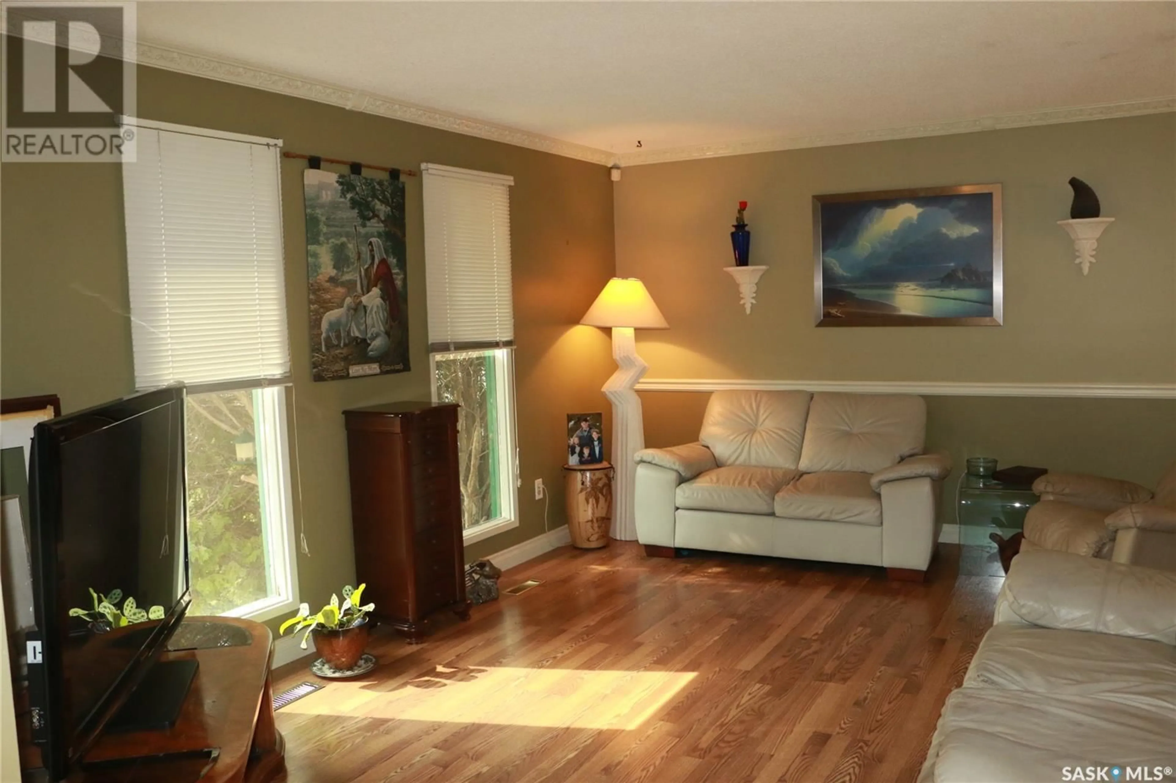 Living room with furniture, wood/laminate floor for 201 CANORA STREET, Warman Saskatchewan S0K0A1