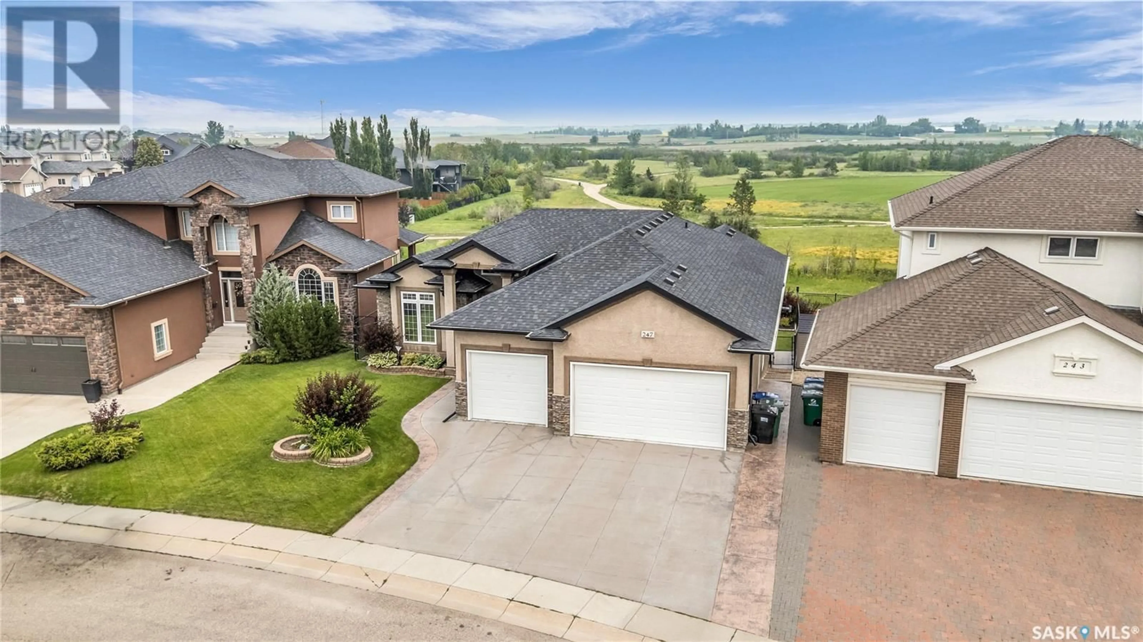A pic from outside/outdoor area/front of a property/back of a property/a pic from drone, unknown for 247 BEECHDALE COURT, Saskatoon Saskatchewan S7V0A4