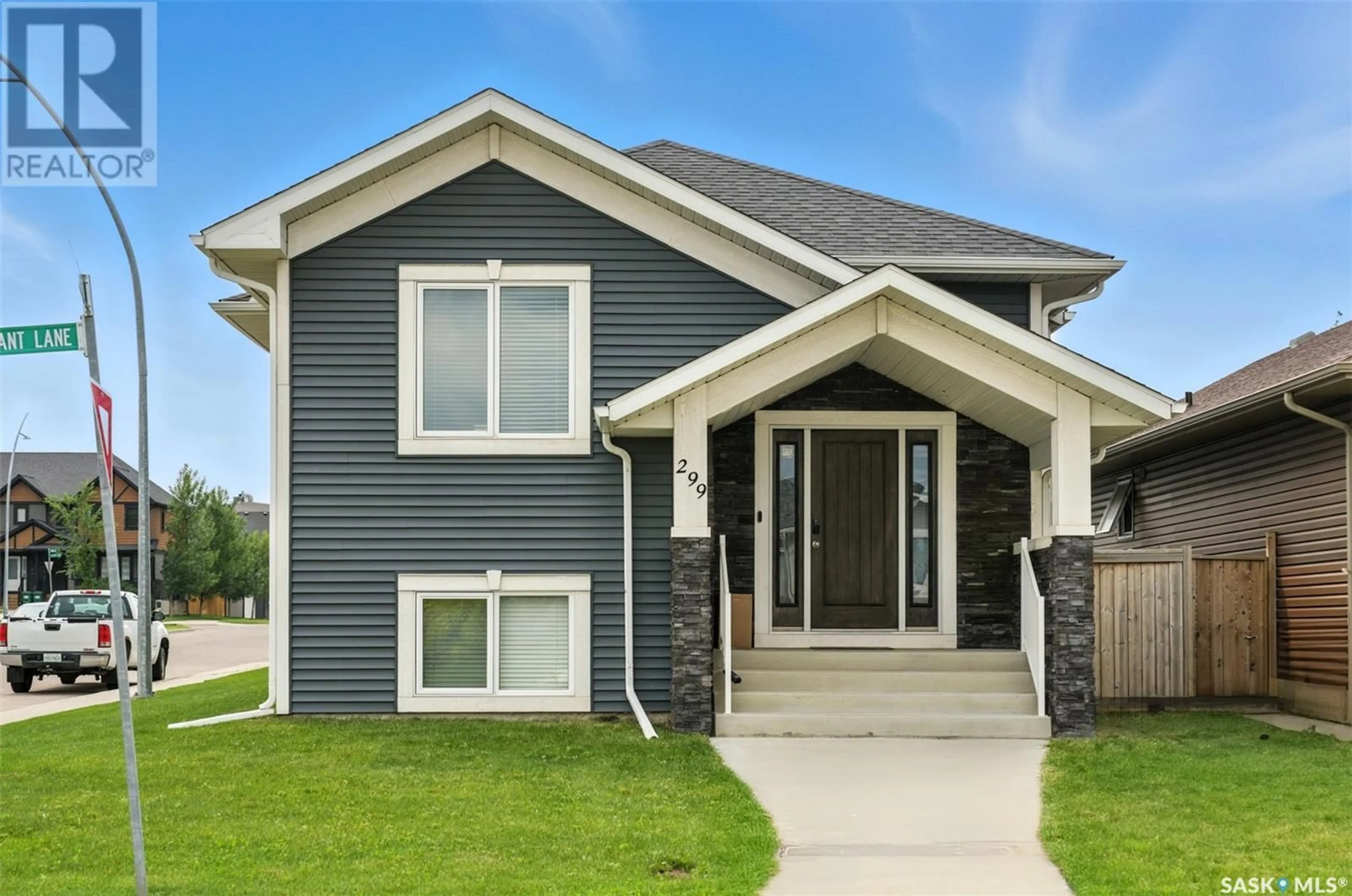 Home with vinyl exterior material, street for 299 WYANT LANE, Saskatoon Saskatchewan S7W0L3