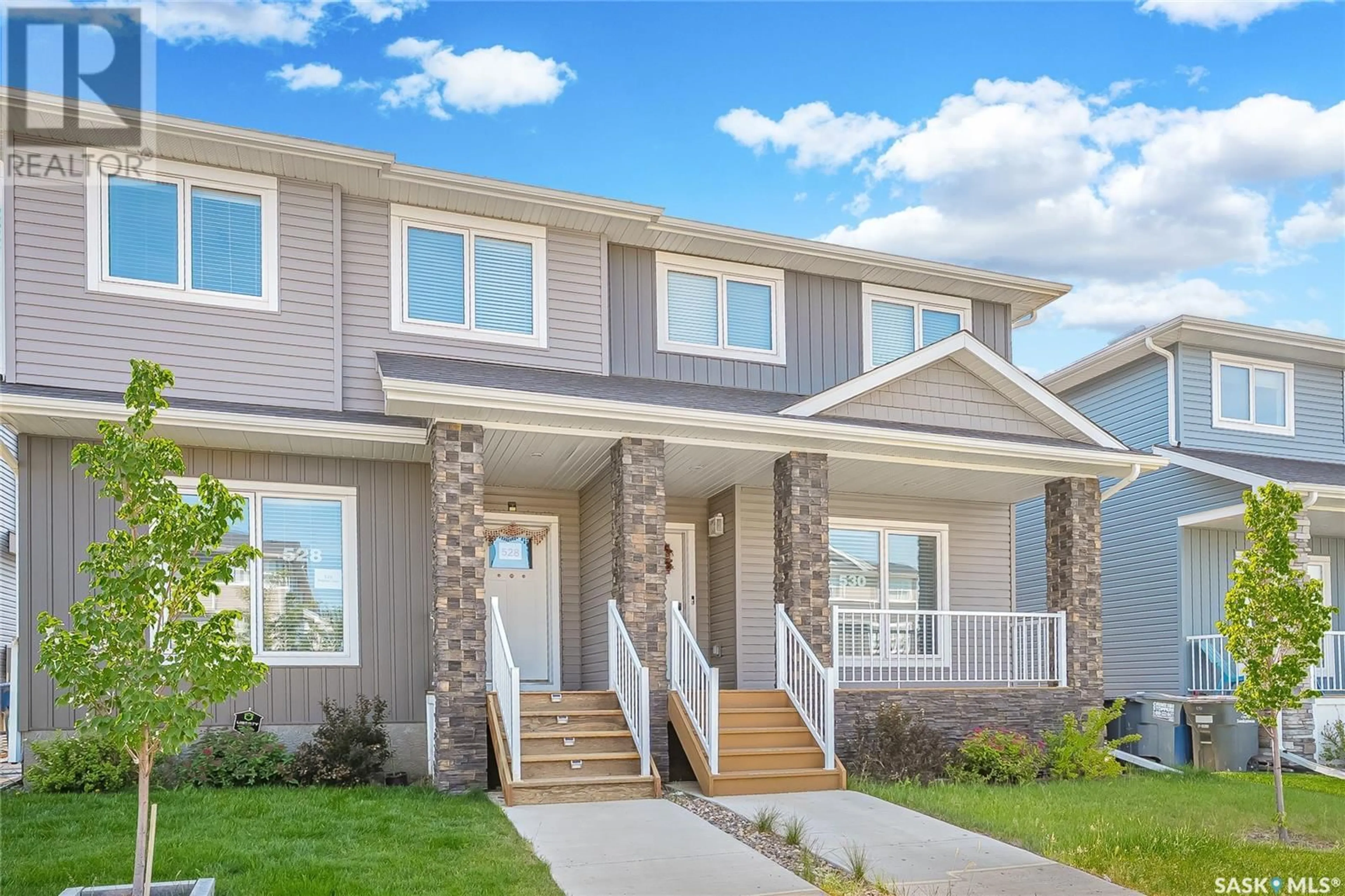 Home with vinyl exterior material, street for 530 BRIGHTON GATE, Saskatoon Saskatchewan S7V0V6