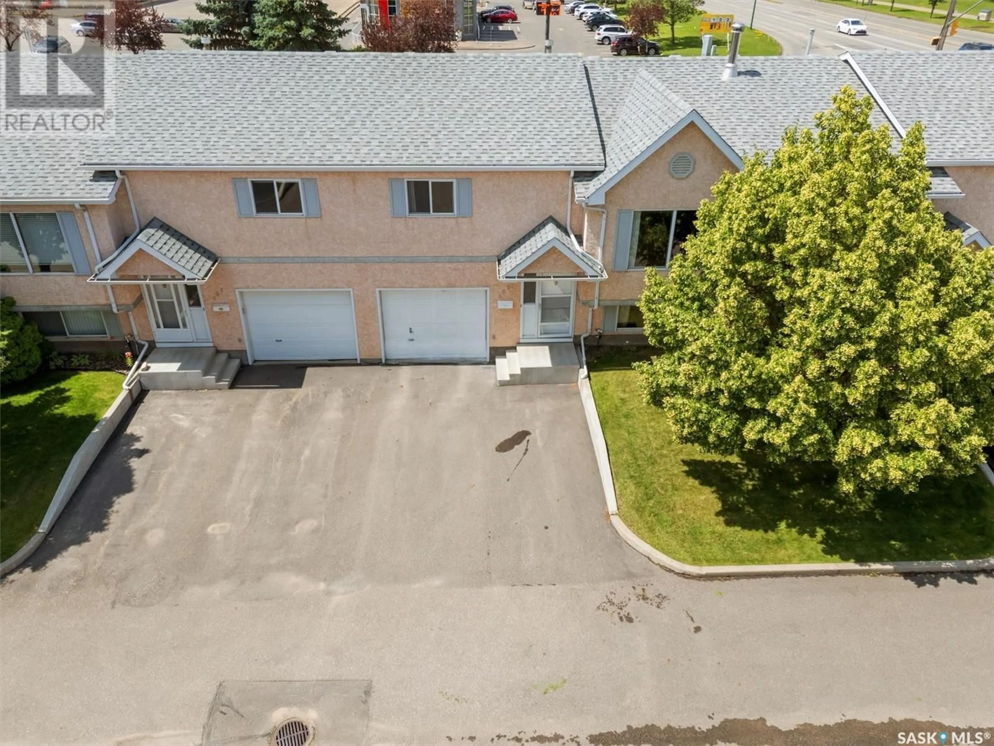 A pic from outside/outdoor area/front of a property/back of a property/a pic from drone, street for 107 - 610 PEREHUDOFF CRESCENT, Saskatoon Saskatchewan S7N4H5