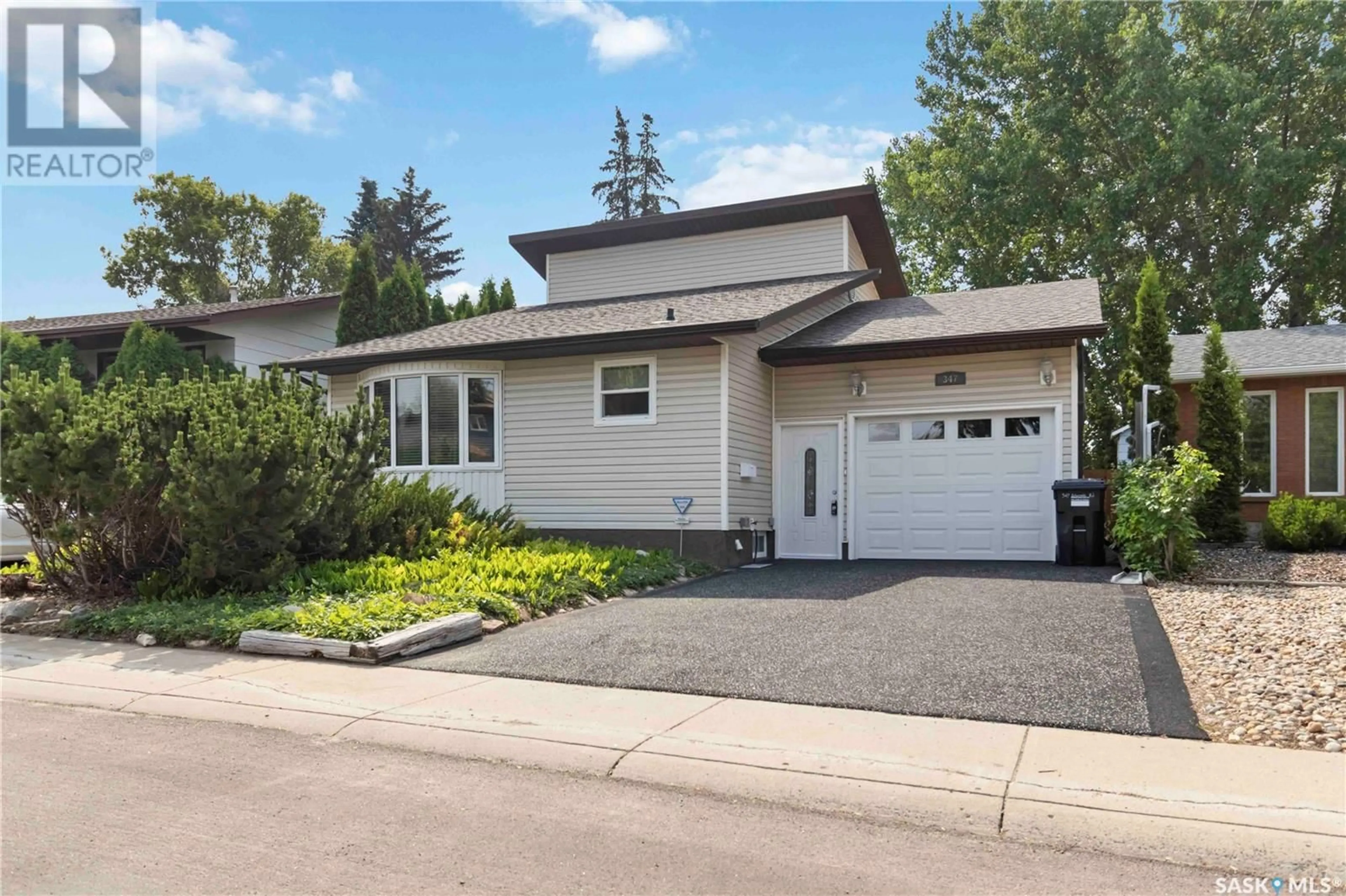 Home with vinyl exterior material, street for 347 DELARONDE ROAD, Saskatoon Saskatchewan S7J3Y5