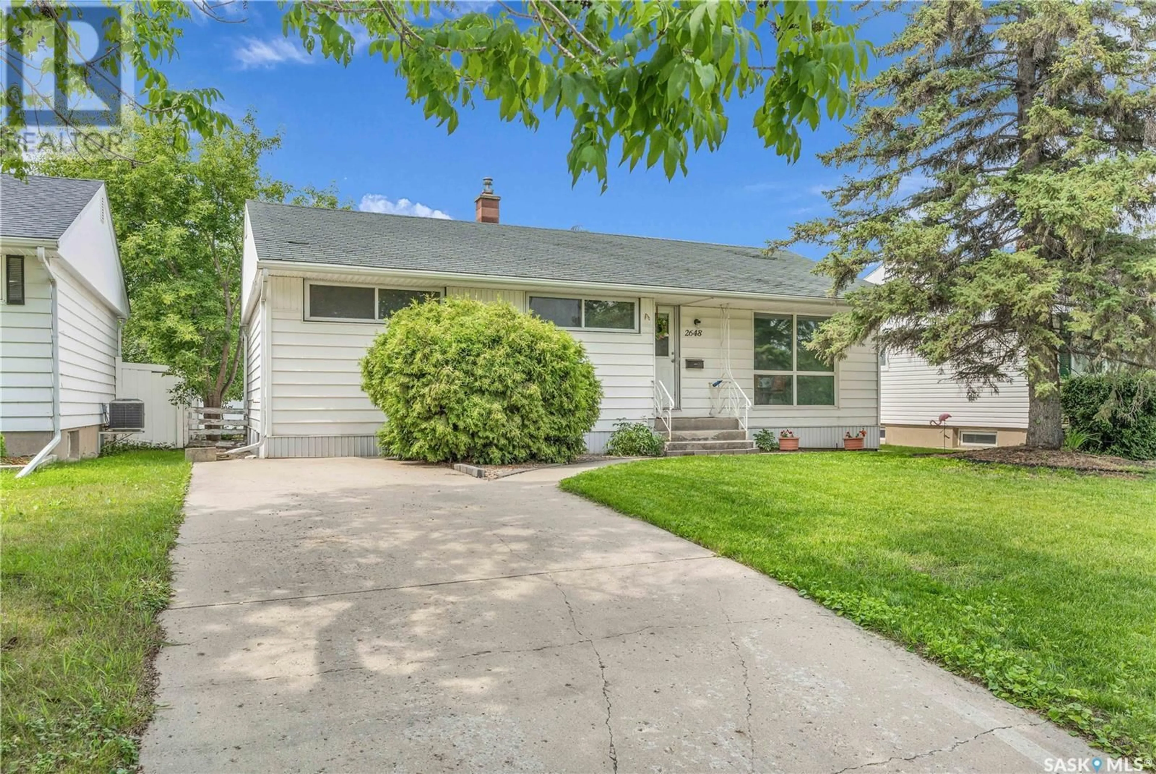 Home with vinyl exterior material, street for 2648 ROTHWELL STREET, Regina Saskatchewan S4N2E1