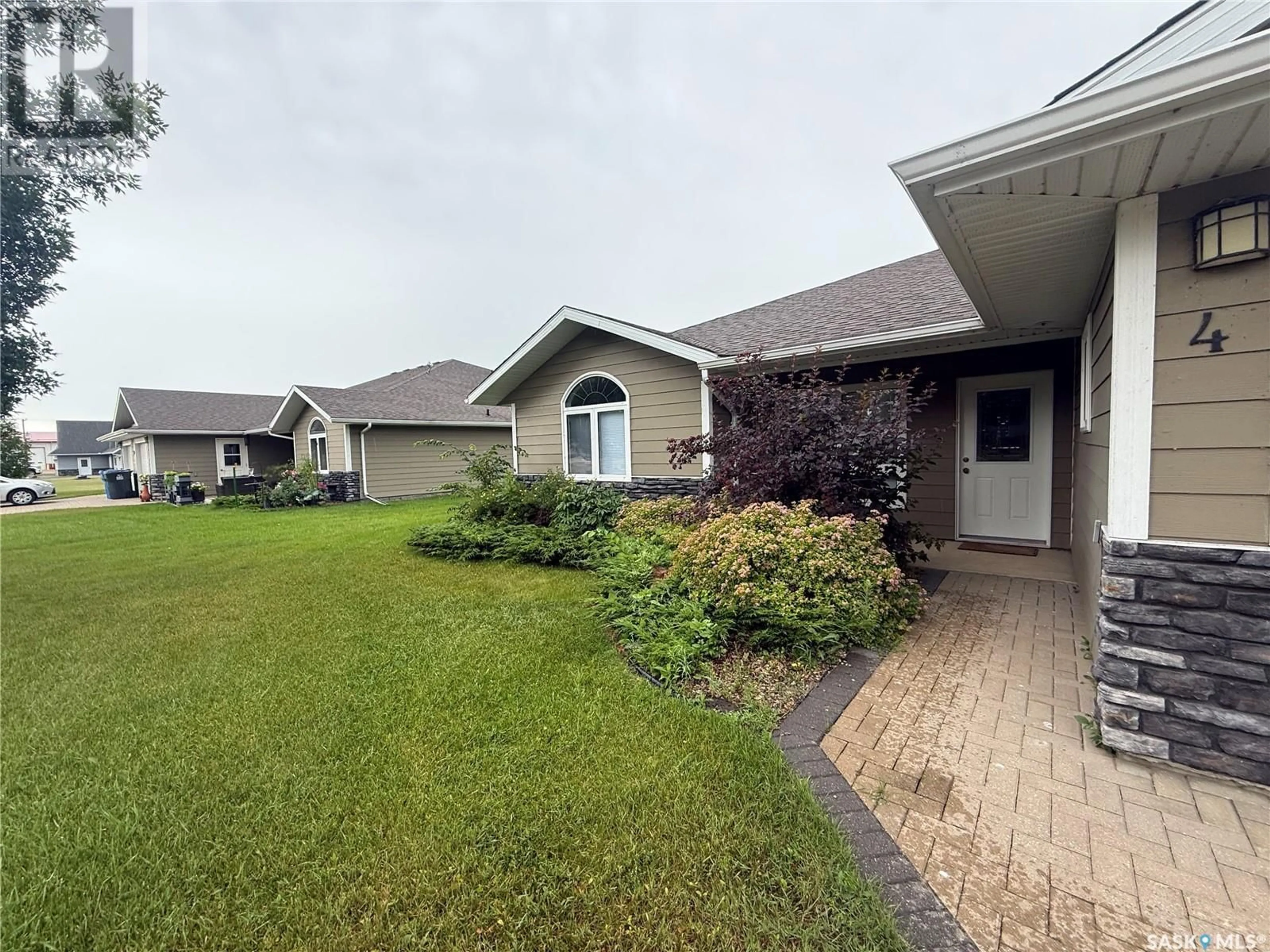 A pic from outside/outdoor area/front of a property/back of a property/a pic from drone, water/lake/river/ocean view for #4 - 314 SOURIS AVENUE, Carnduff Saskatchewan S0C0S0