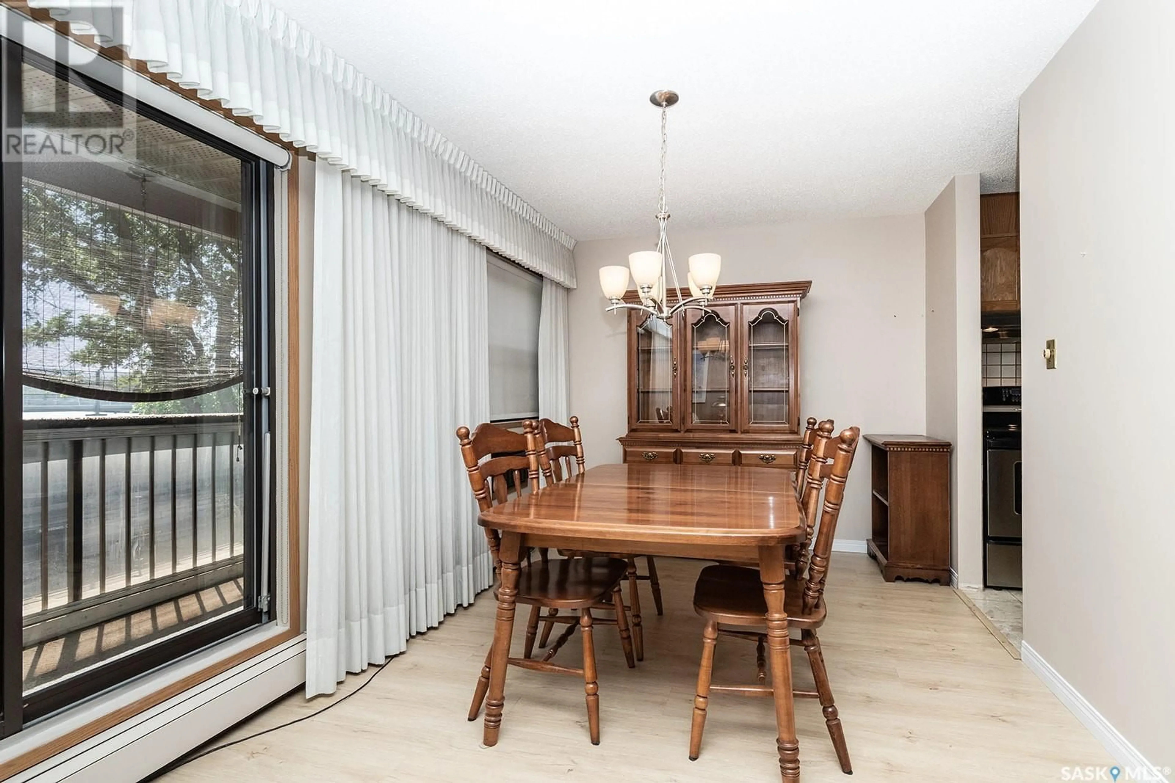 Dining room, wood/laminate floor for 308 - 525 5TH AVENUE, Saskatoon Saskatchewan S7K2R1