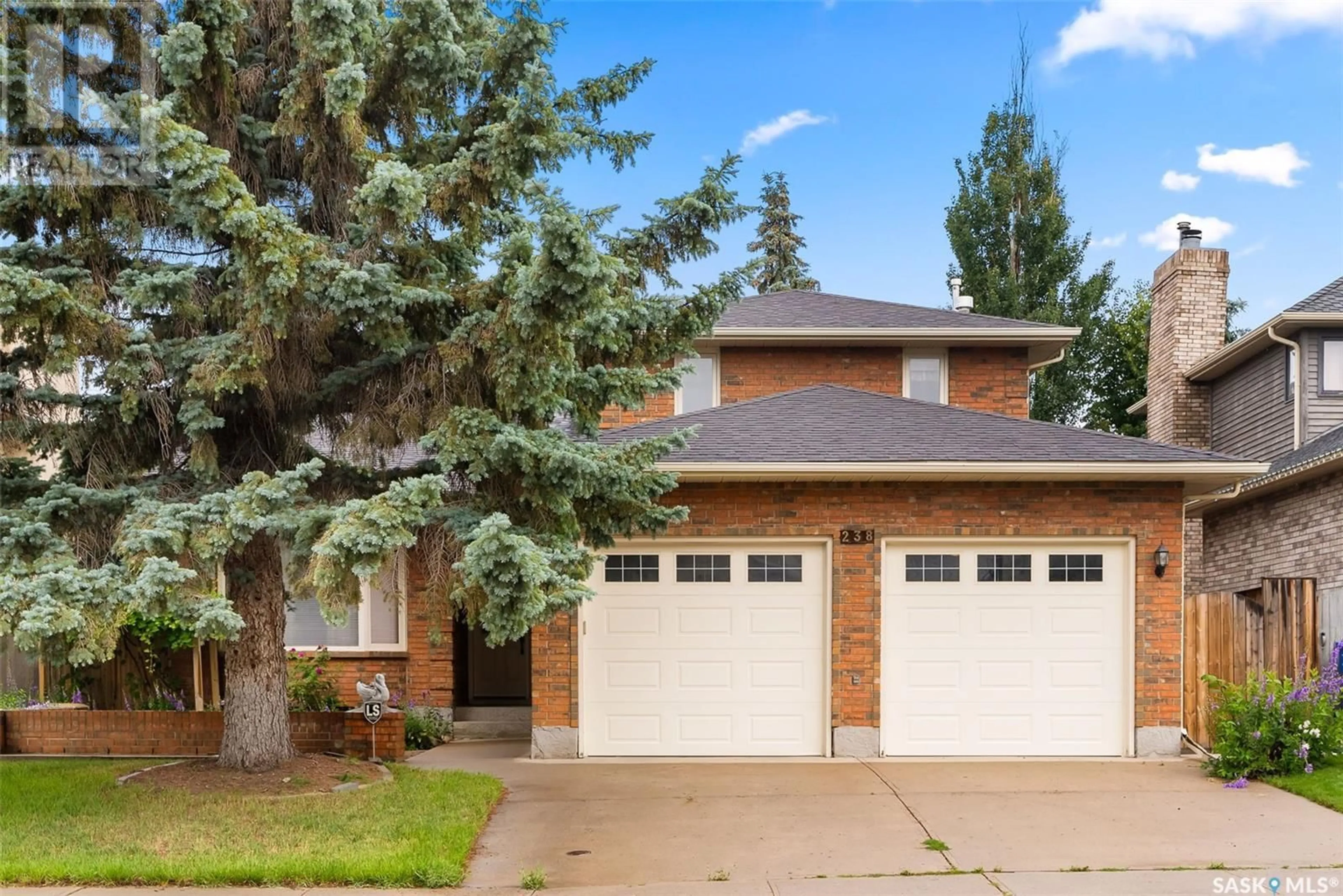 Home with brick exterior material, street for 238 ROGERS ROAD, Regina Saskatchewan S4S7C4