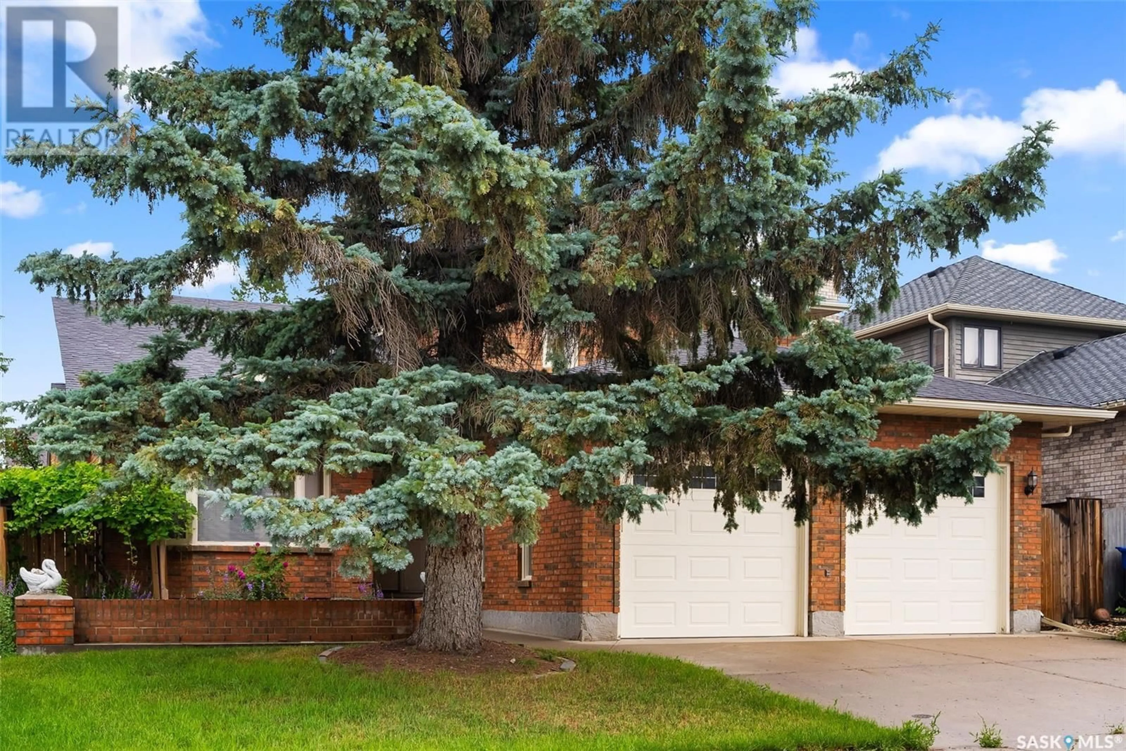 Home with brick exterior material, street for 238 ROGERS ROAD, Regina Saskatchewan S4S7C4