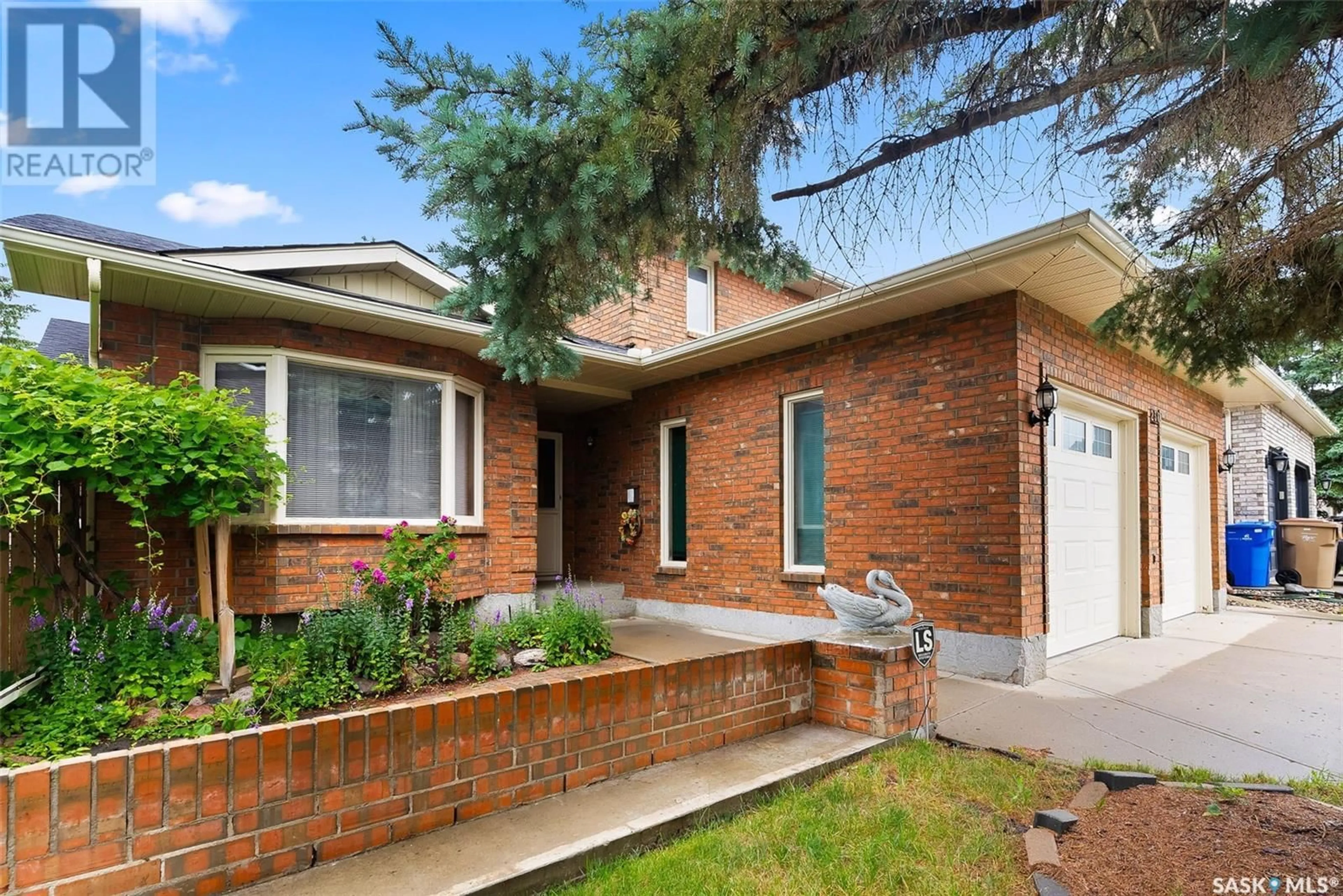 Home with brick exterior material, street for 238 ROGERS ROAD, Regina Saskatchewan S4S7C4