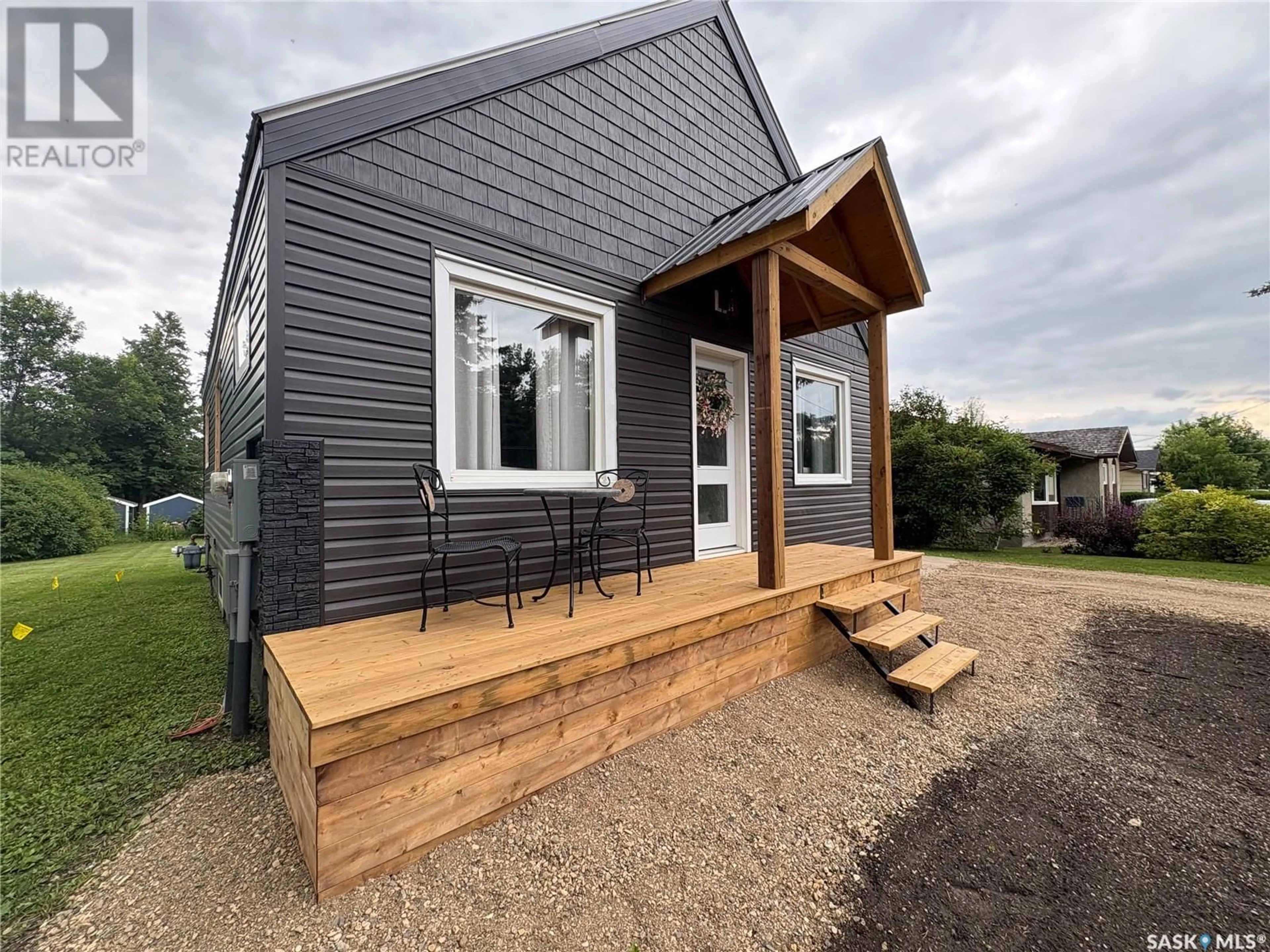 Home with vinyl exterior material, street for E - 212 RIEDEL AVENUE, Langenburg Saskatchewan S0A2A0