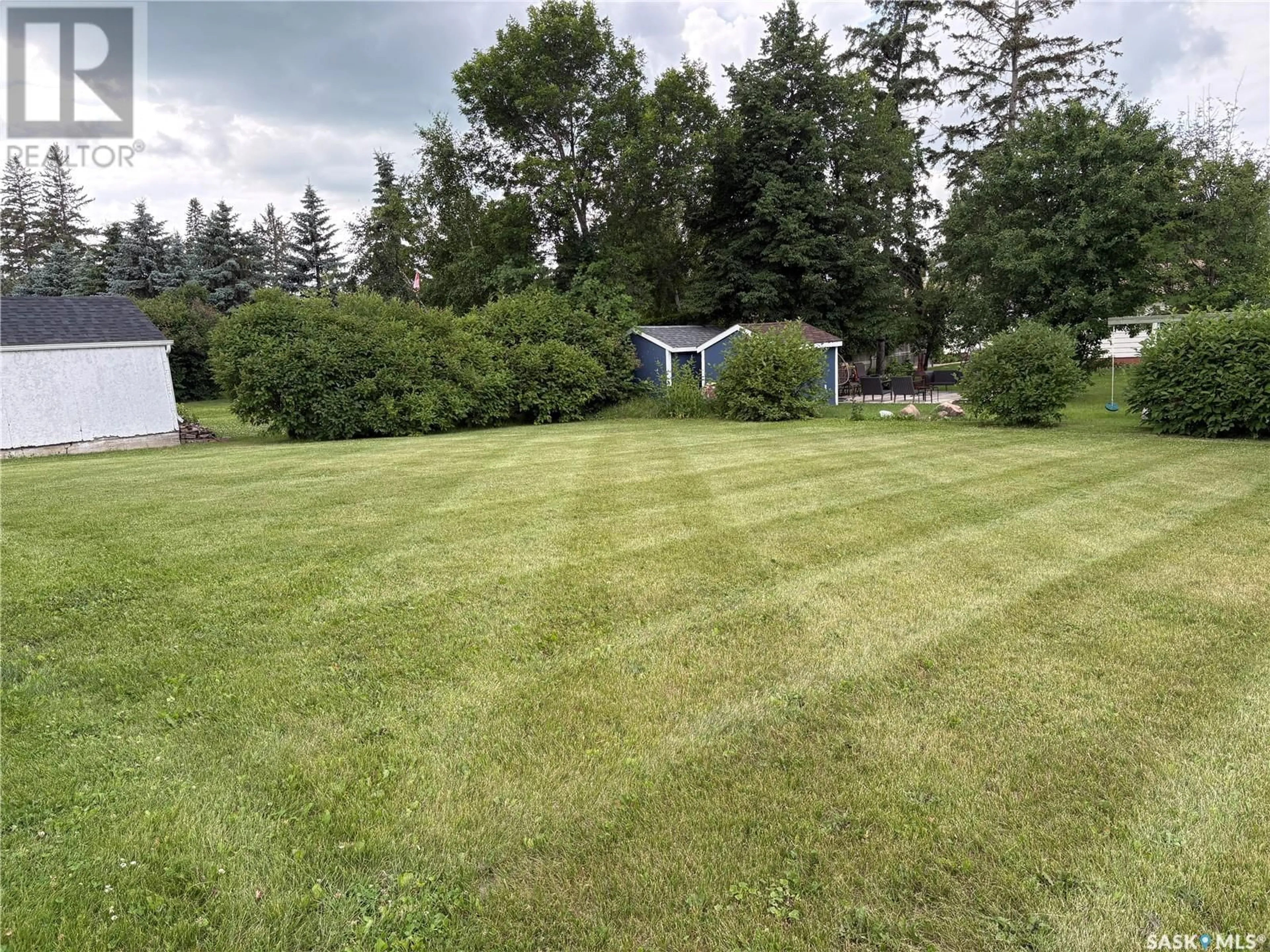 A pic from outside/outdoor area/front of a property/back of a property/a pic from drone, unknown for E - 212 RIEDEL AVENUE, Langenburg Saskatchewan S0A2A0
