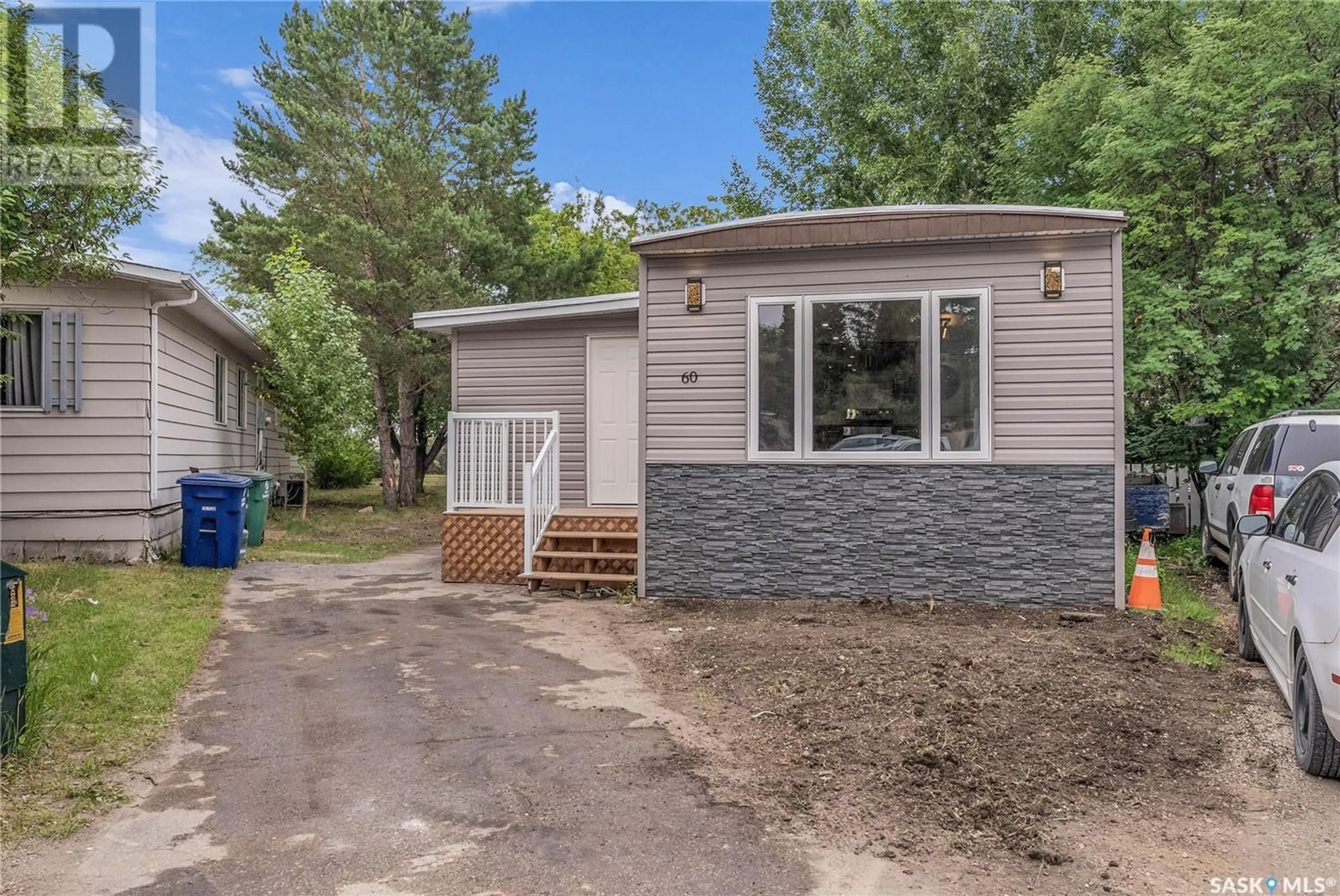 Home with vinyl exterior material, street for 60 1035 BOYCHUK DRIVE, Saskatoon Saskatchewan S7H5B2